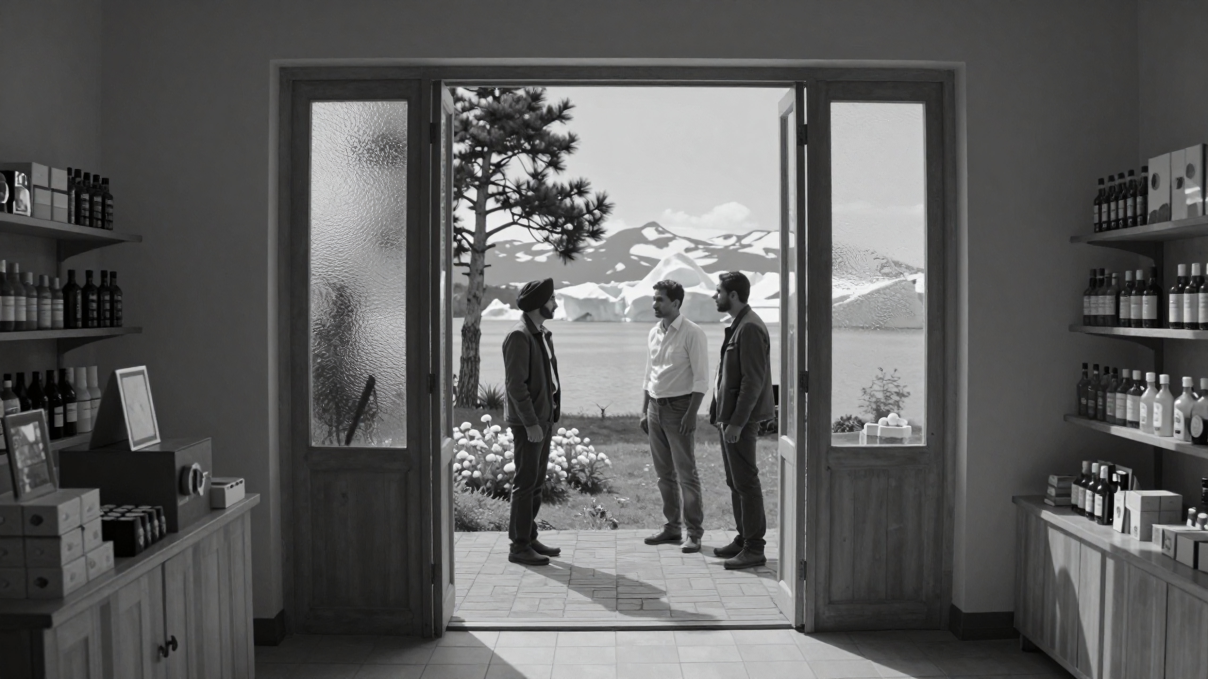 Three Men at Threshold Between Indoor Retail Space and Mountainous Landscape