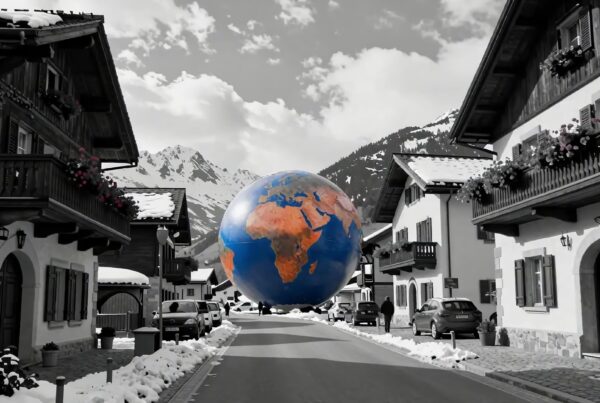 4K Video - Giant Earth globe magically hovering over picturesque snowy European mountain village streets during festive season.
