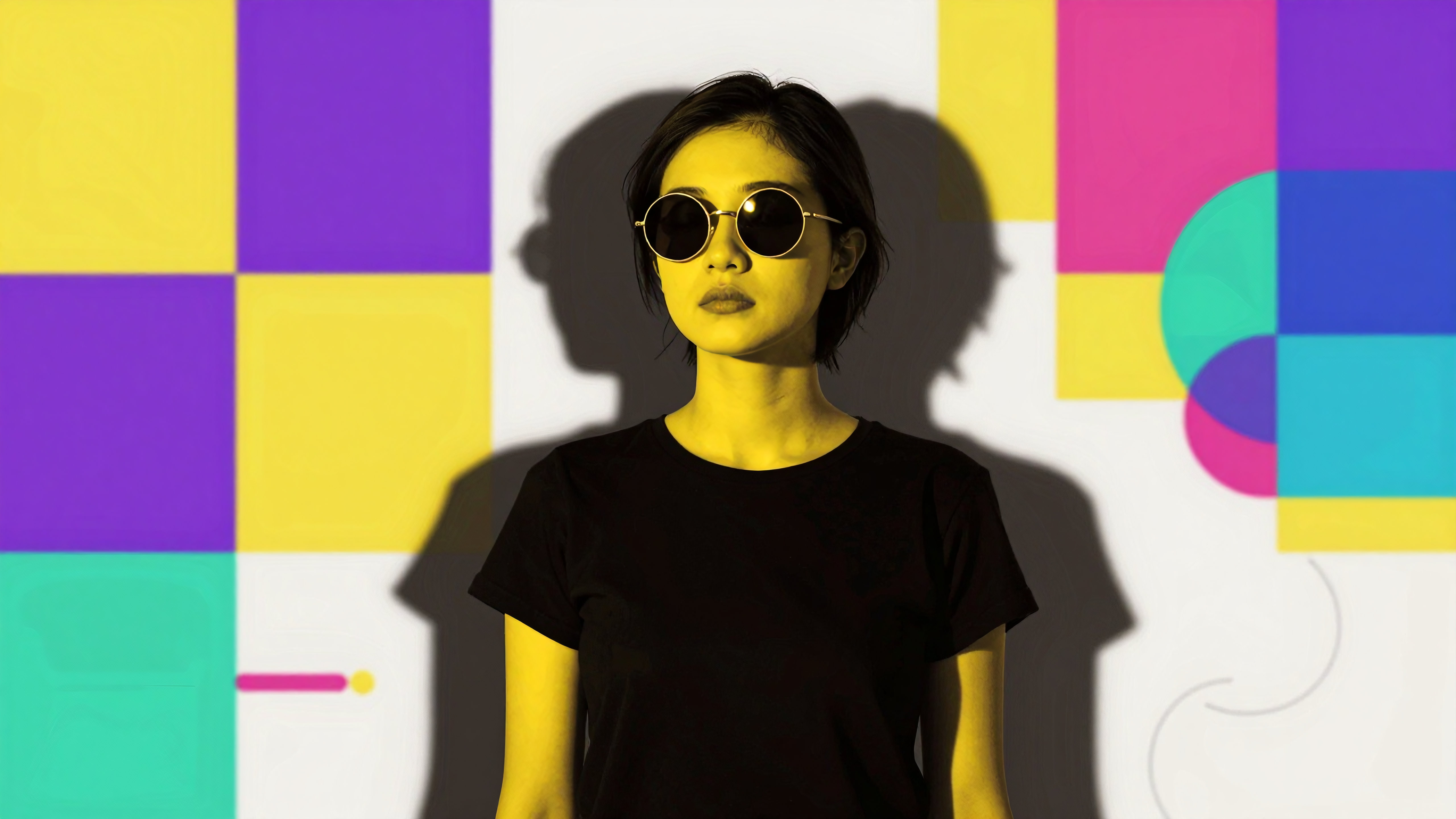 Portrait of Person in Black T-Shirt Against Vibrant Geometric Background