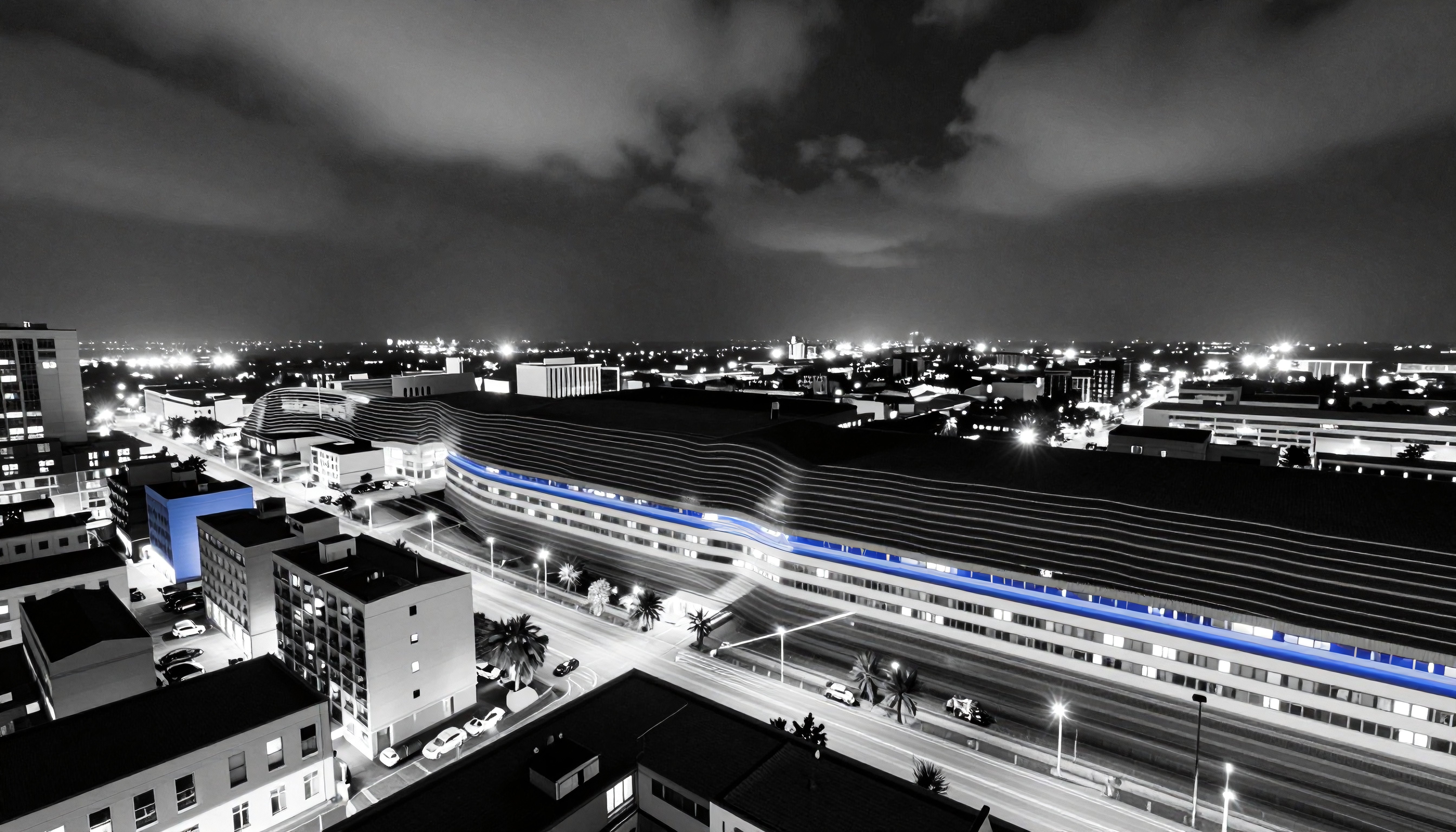Nighttime Cityscape with Modern Architecture and Illuminated Streets
