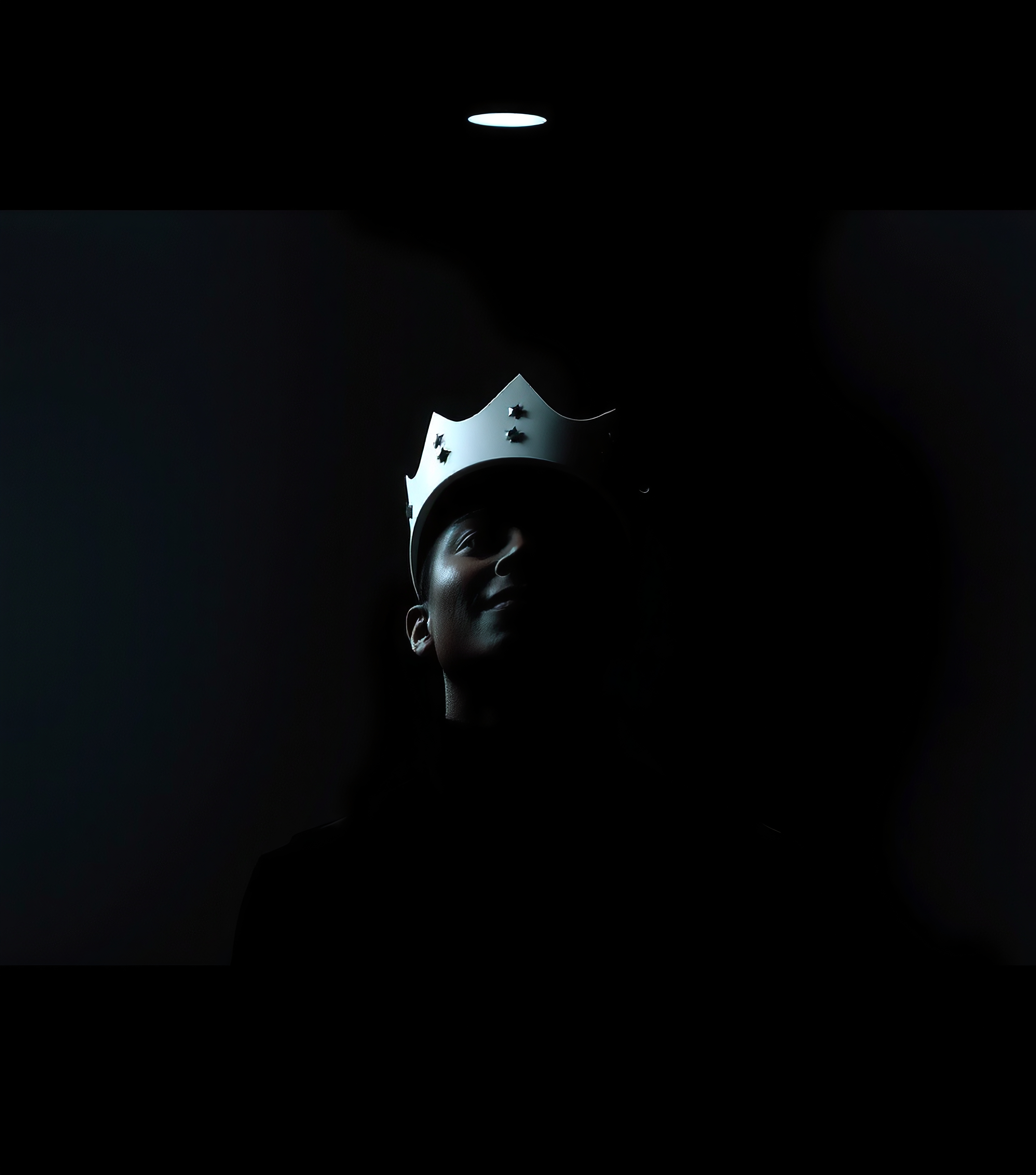 Mysterious Portrait of a Figure Wearing a Crown in Low Light