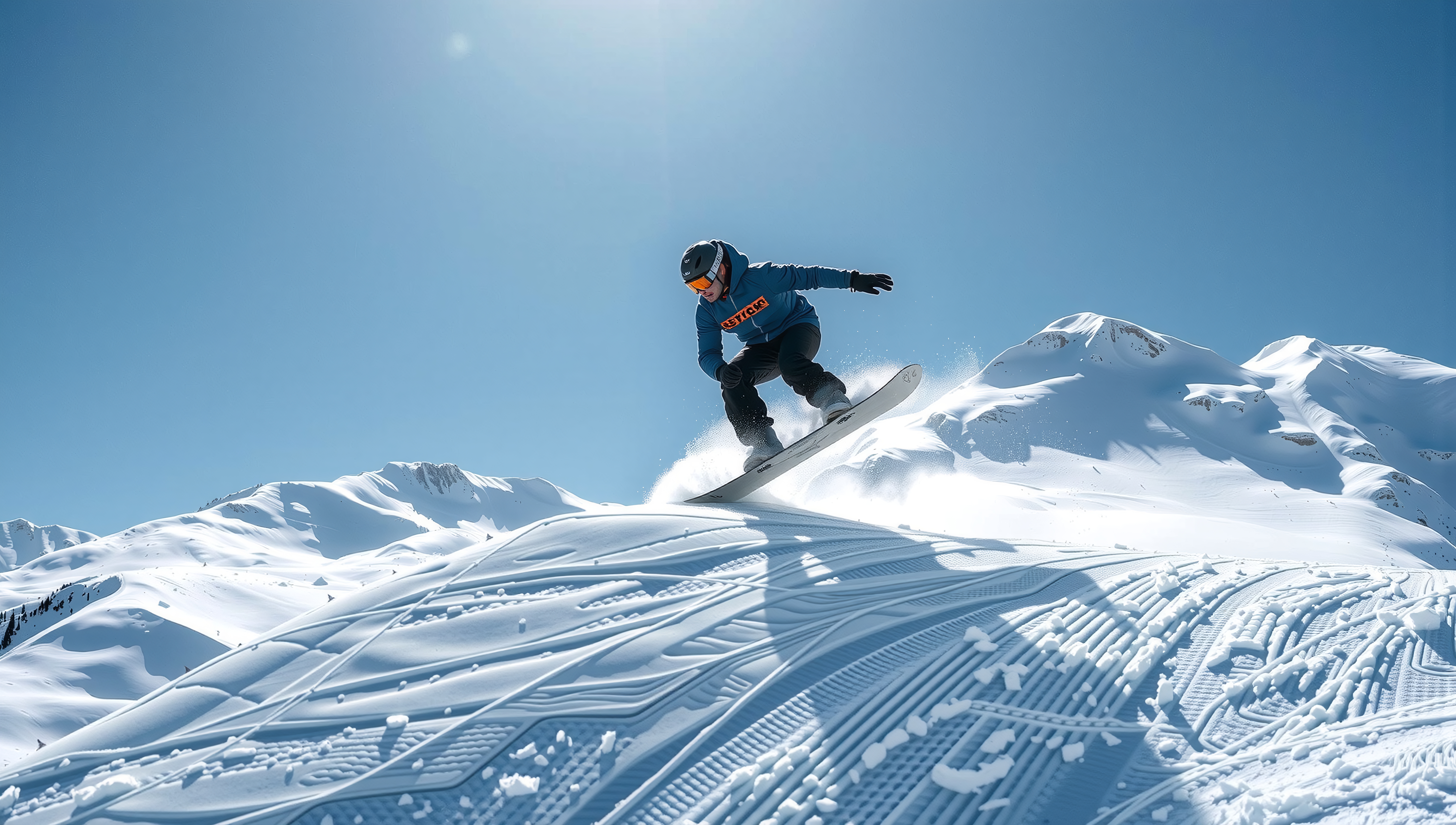 A snowboarder jumps on a snowy mountain with a clear blue sky.