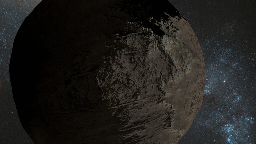 A large rocky celestial body partially illuminated against a star-filled backdrop, showcasing a textured surface with dramatic lighting and shadows, surrounded by the vastness of space.