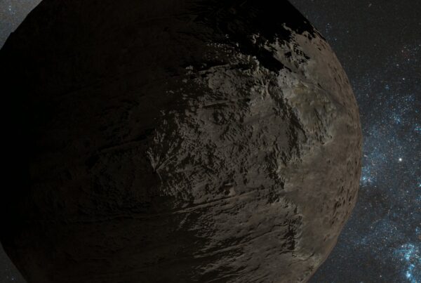 A large rocky celestial body partially illuminated against a star-filled backdrop, showcasing a textured surface with dramatic lighting and shadows, surrounded by the vastness of space.
