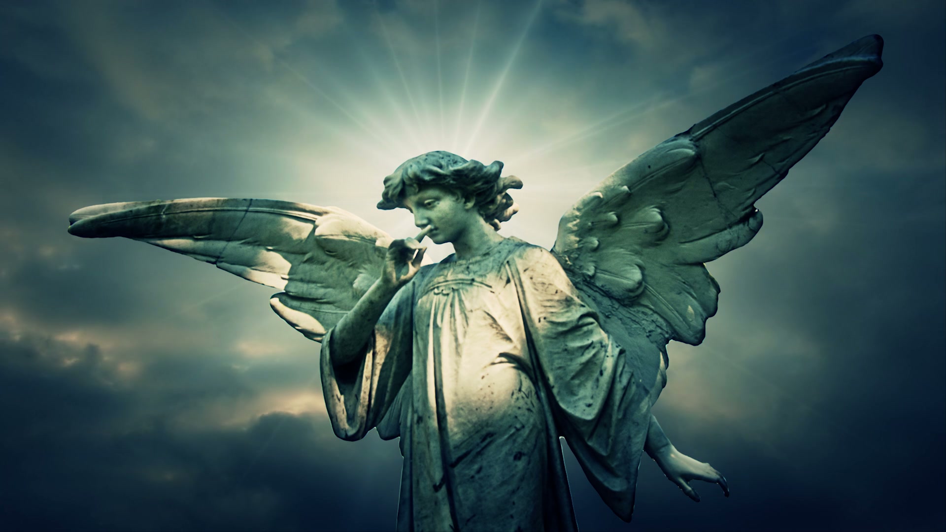 A serene angel statue with outstretched wings and a peaceful expression, set against a dramatic cloudy sky with rays of light, symbolizing ethereal silence and contemplation.
