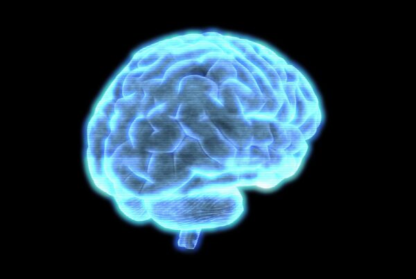 Futuristic digital hologram 4K video loop of a glowing blue human brain against a black background, highlighting advanced technology and neural connections.