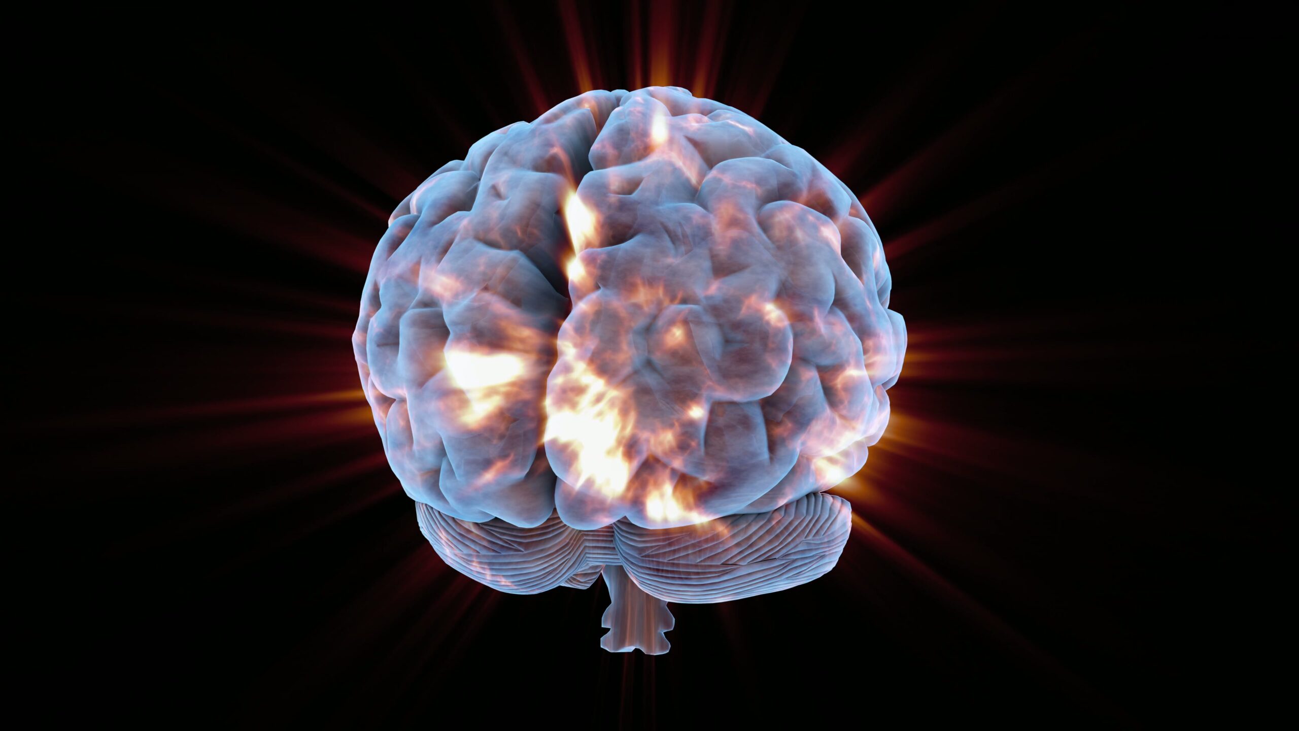 A digitally rendered human brain glowing with radiant energy, illustrating neural activity and creativity.