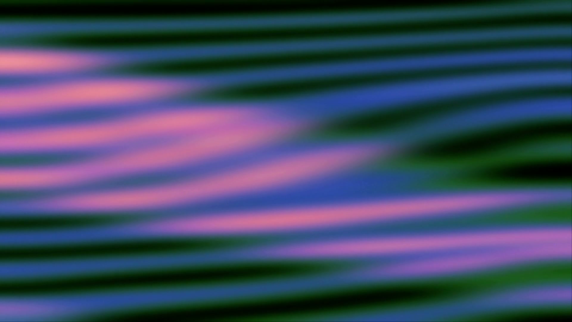 Abstract video loop featuring colorful wavy patterns of purple, blue, and green, creating a seamless and calming visual effect reminiscent of ripples or flowing fabric.
