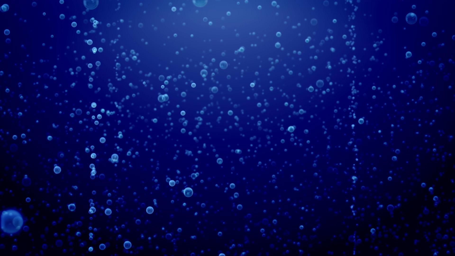 Floating Bubbles Illuminated Against Dark Blue Background