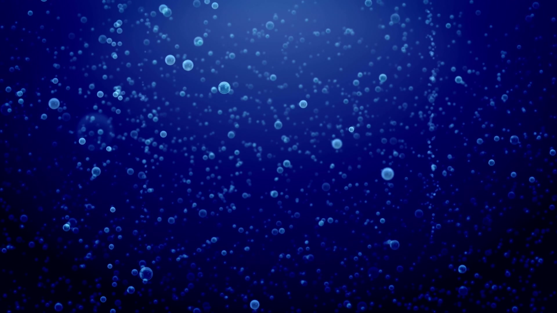 Underwater video loop with countless small bubbles rising through a deep blue background, creating a serene and ethereal atmosphere.