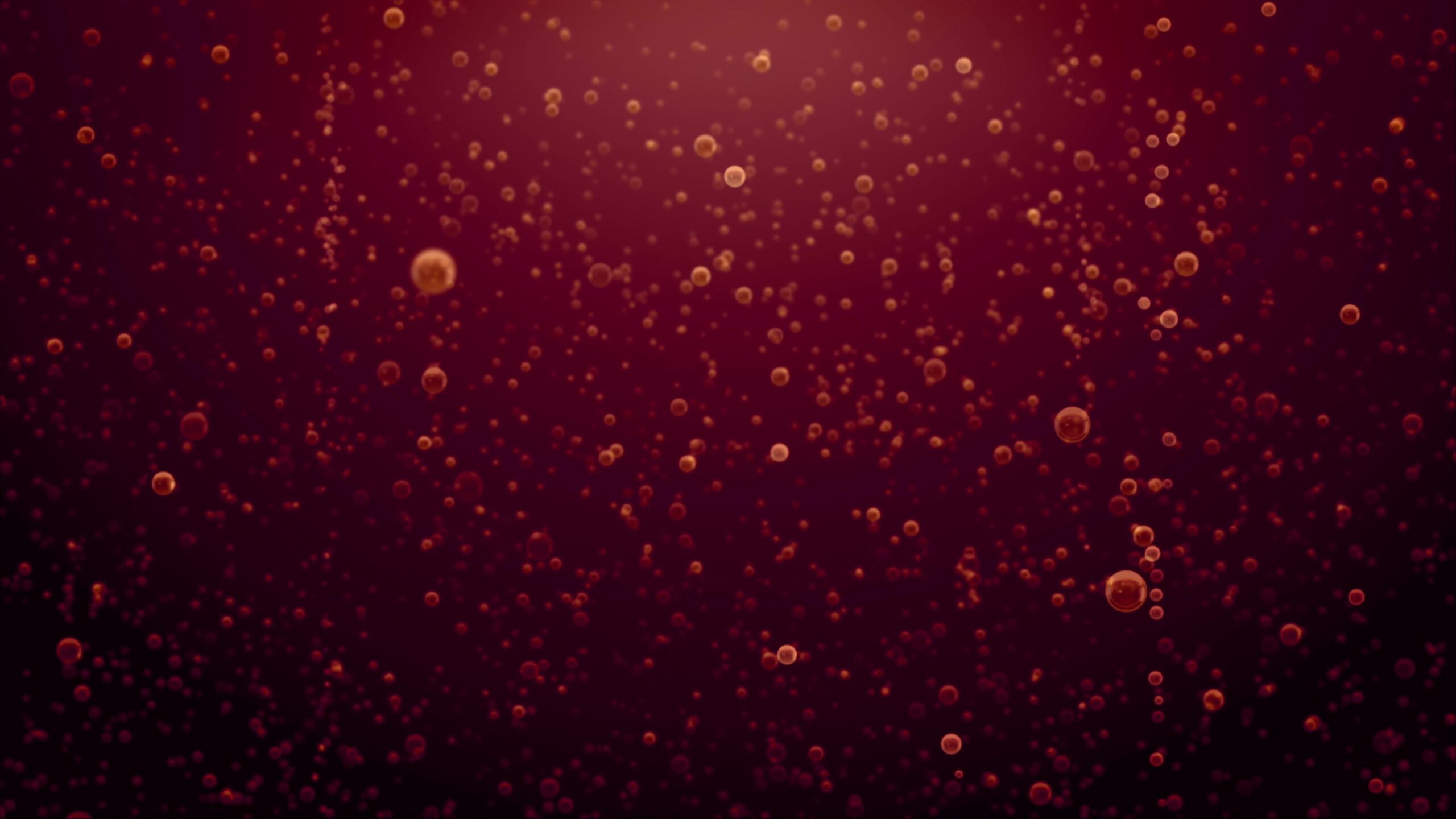 A swirling array of glowing red-orange bubbles floats upward against dark maroon background.