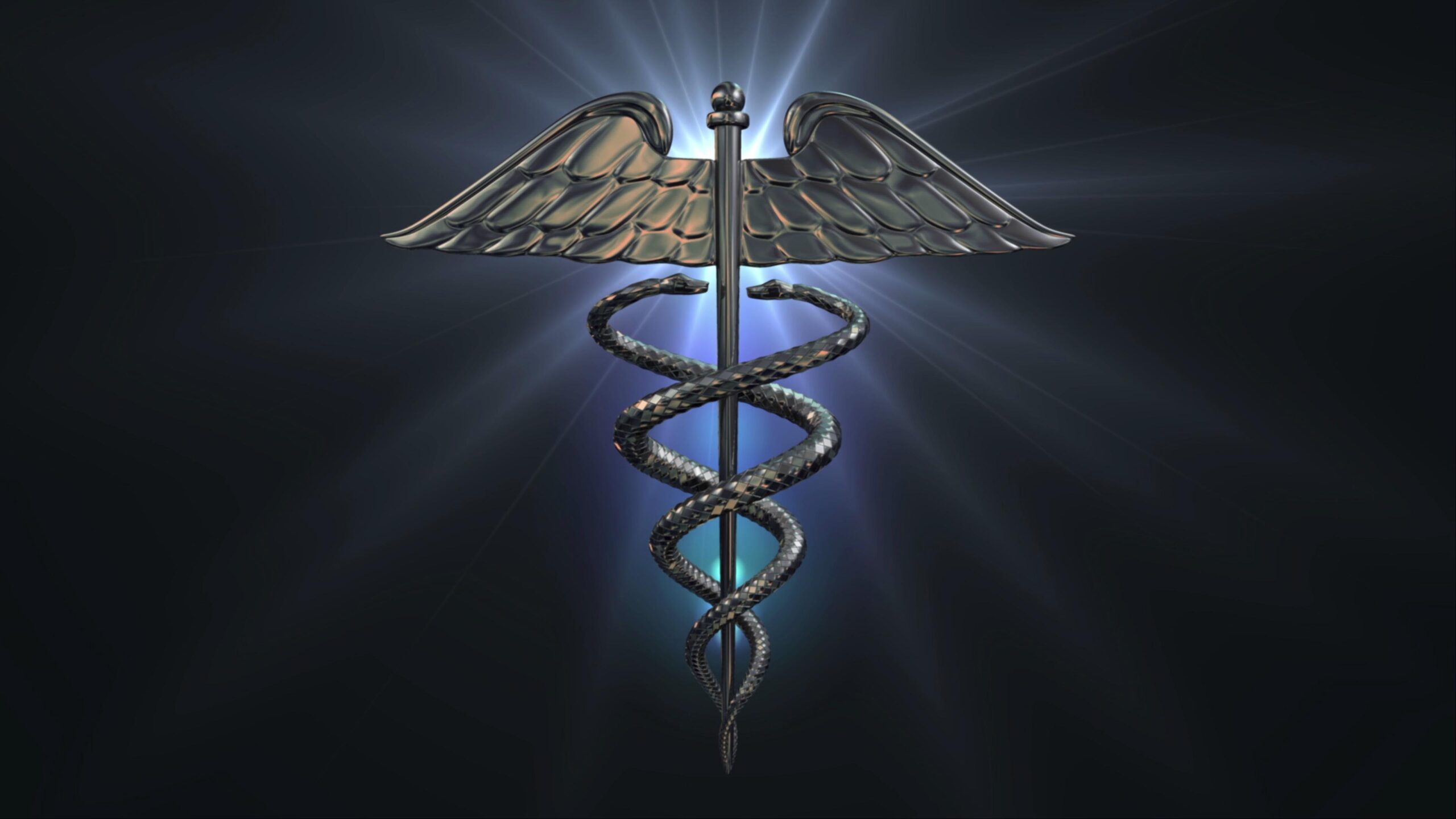 4K video of a rotating, metallic caduceus symbol with two entwined serpents and wings, set against a radiant dark background.