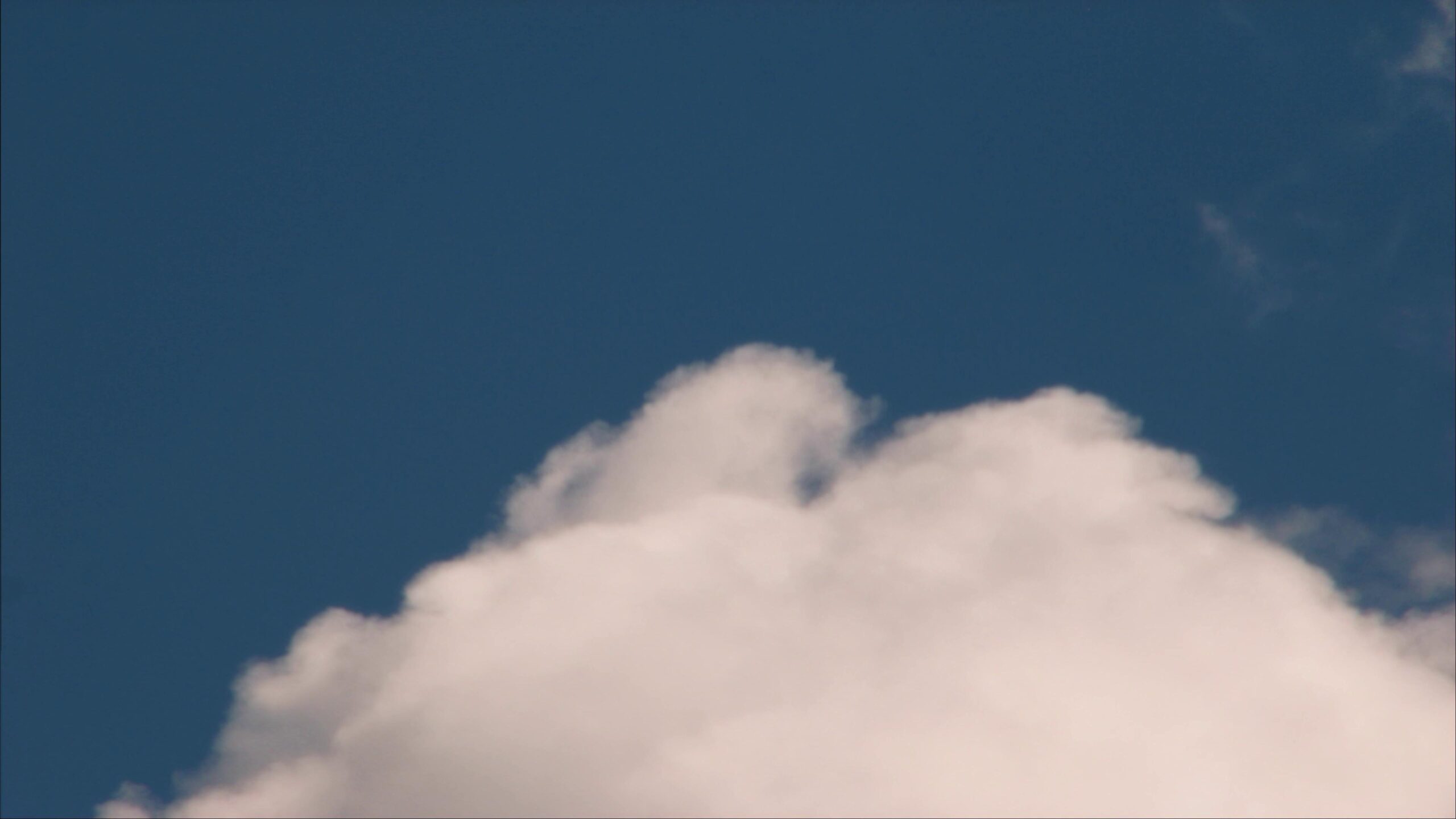 Time-lapse cloudy skies changing from sunny to stormy conditions
