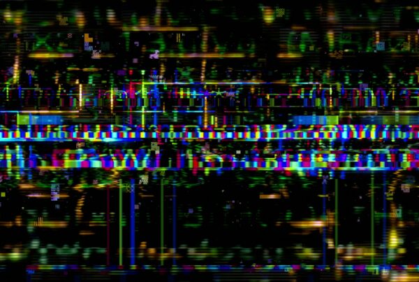 A vibrant abstract video loop featuring colorful digital glitch art with horizontal bands and pixelated patterns against a dark background.
