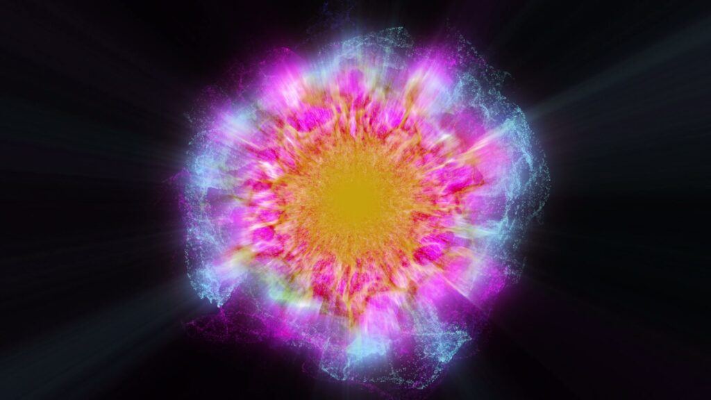 Abstract HD video of a vibrant, colorful explosion with a bright yellow center and radiating pink, purple, and blue hues against a black background.