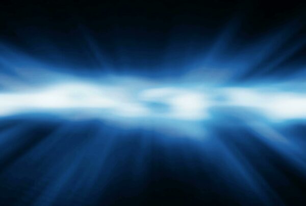 Abstract video loop featuring a central bright band of blue and white light with dynamic motion effects, surrounded by darker blue hues creating a sense of depth and energy.