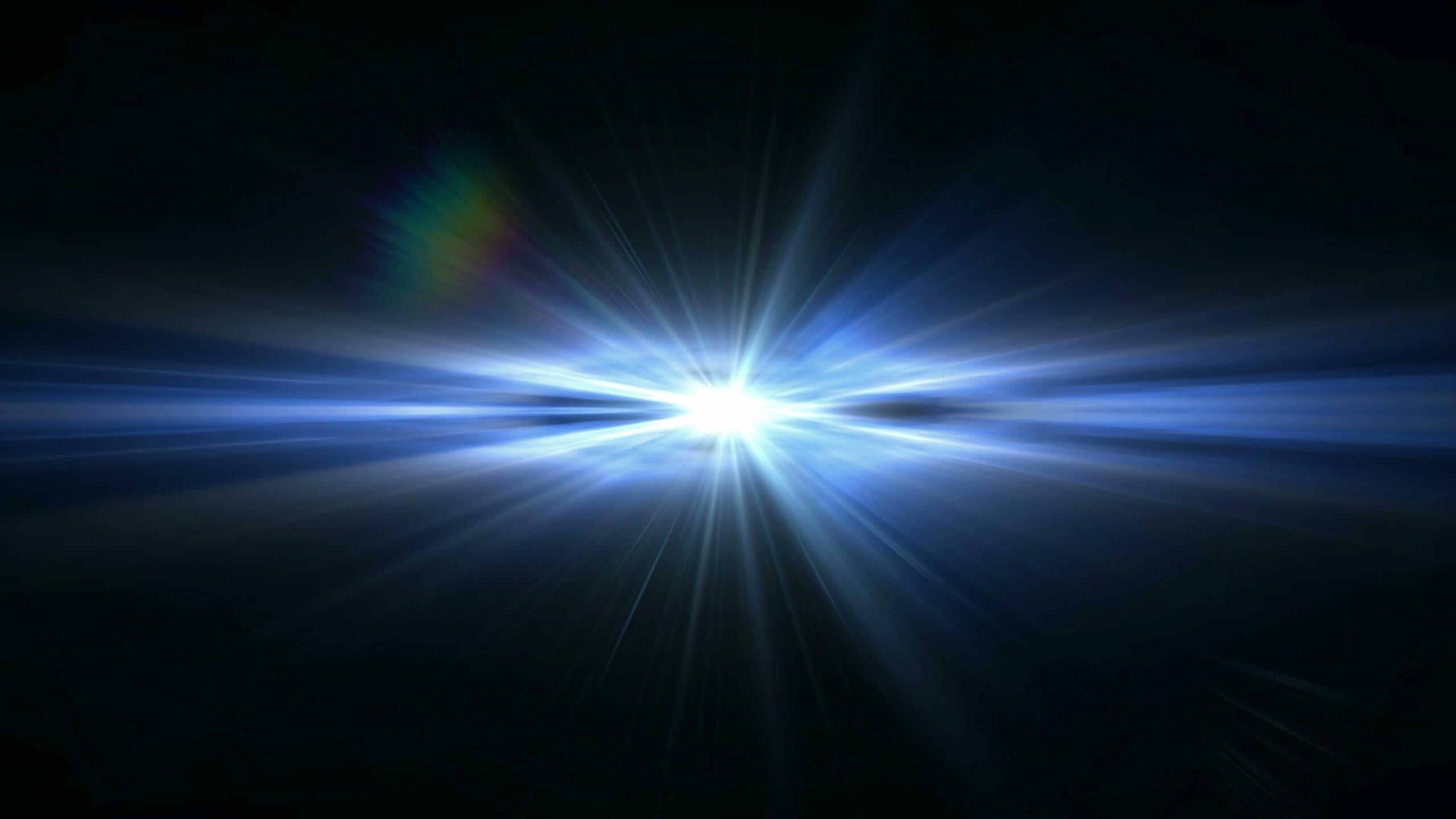 A radiant burst of white light against a dark video background, showcasing blue hues and a subtle spectral flare.