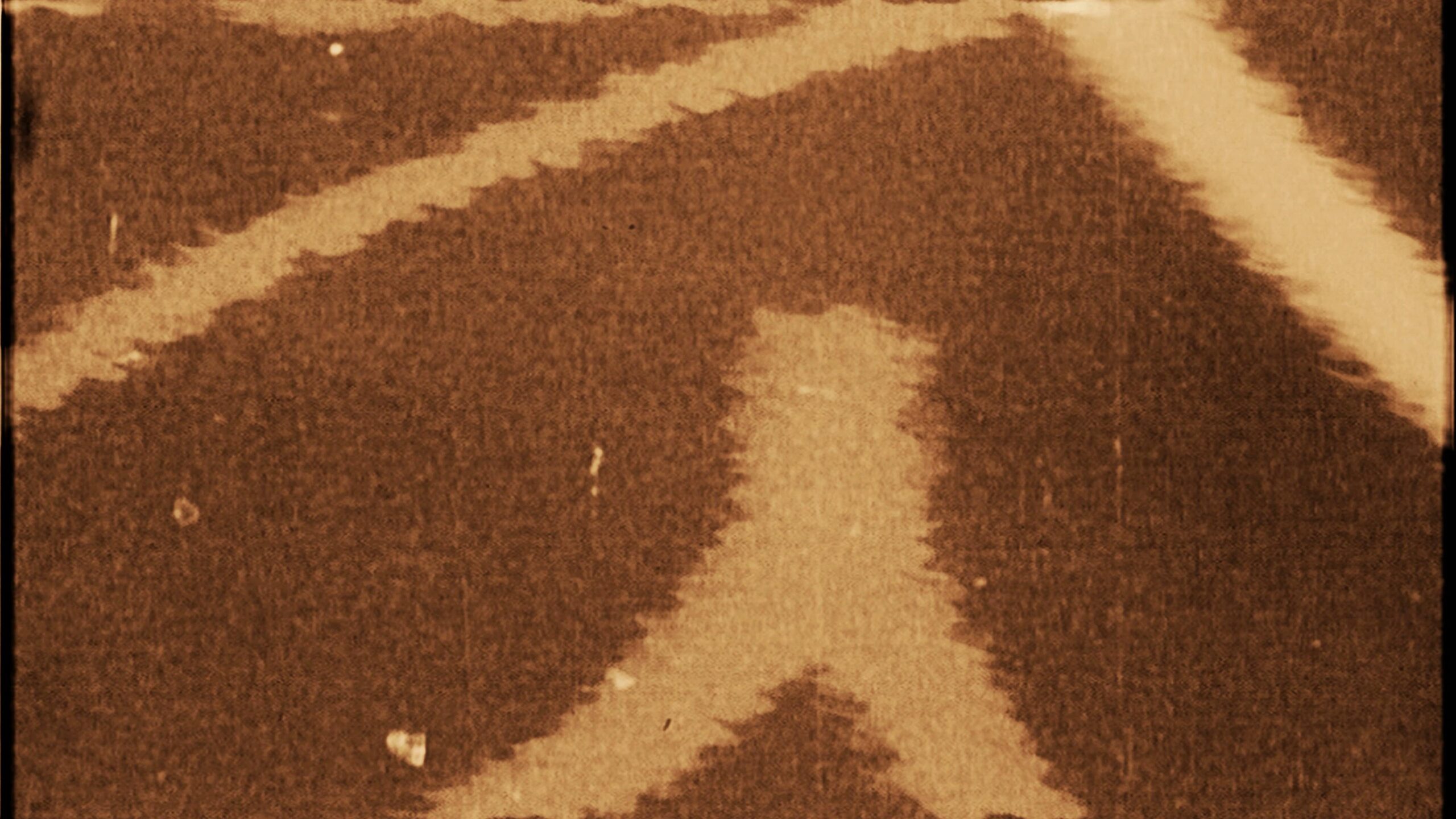 Sepia-toned vintage film with ghostly lights drifting above ancient shadows.