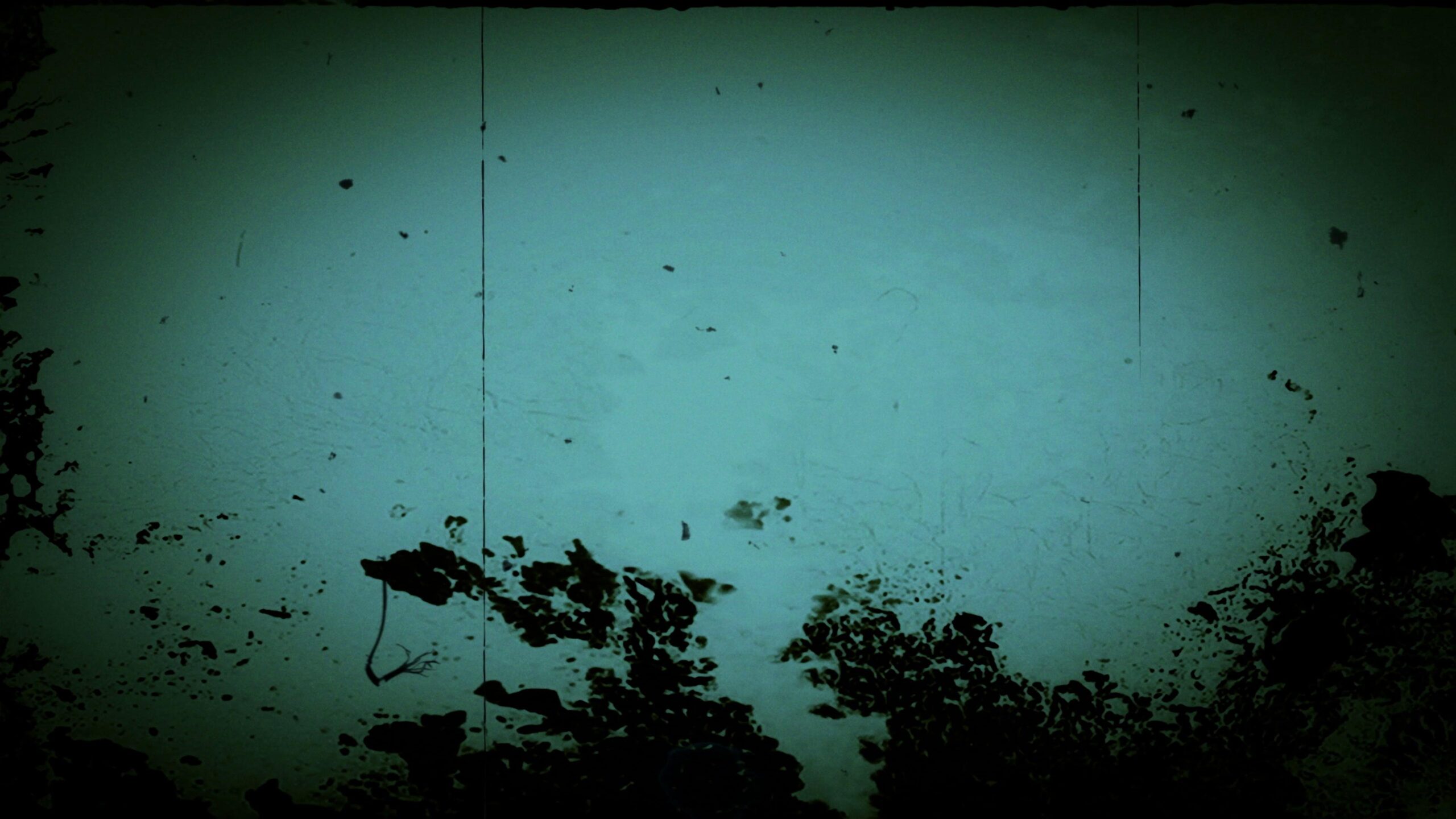 Vintage green film texture with water damage and floating debris.