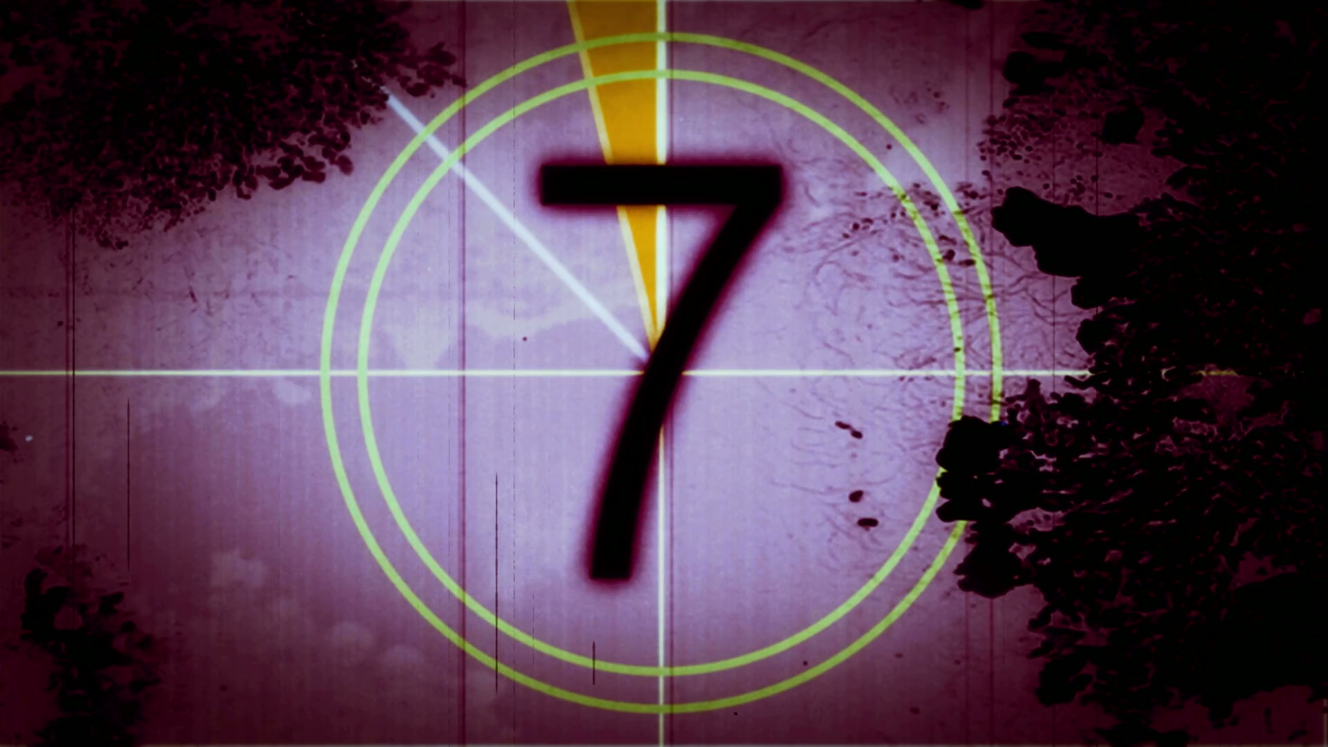Vintage film countdown displaying numbers with a grungy purple background.
