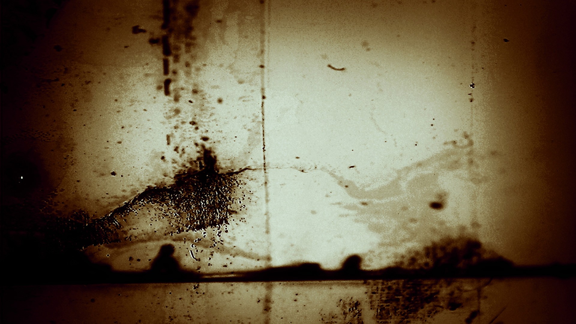 A sepia-toned looping video of distressed film leader with flickering light patterns and water damage.