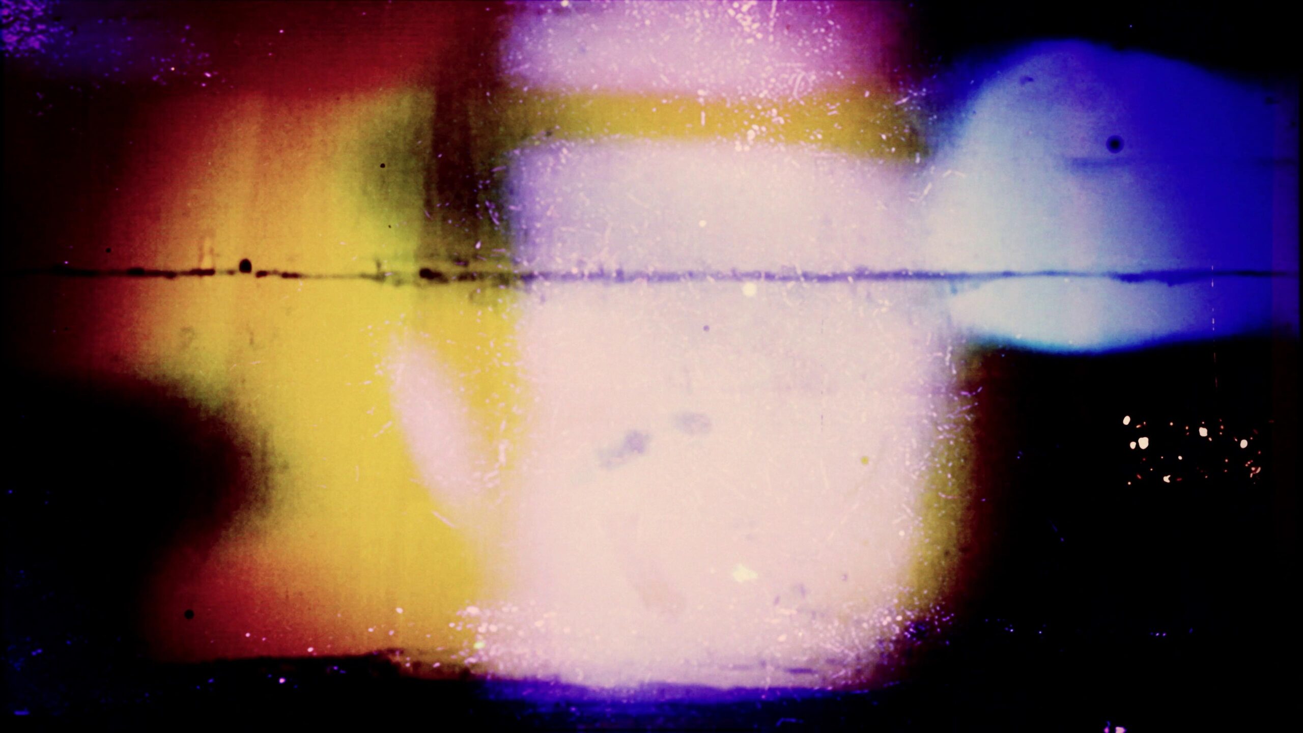 Abstract 4K video loop featuring glowing yellow and purple hues against a dark backdrop, evoking an otherworldly or psychedelic atmosphere reminiscent of vintage film grain effects.