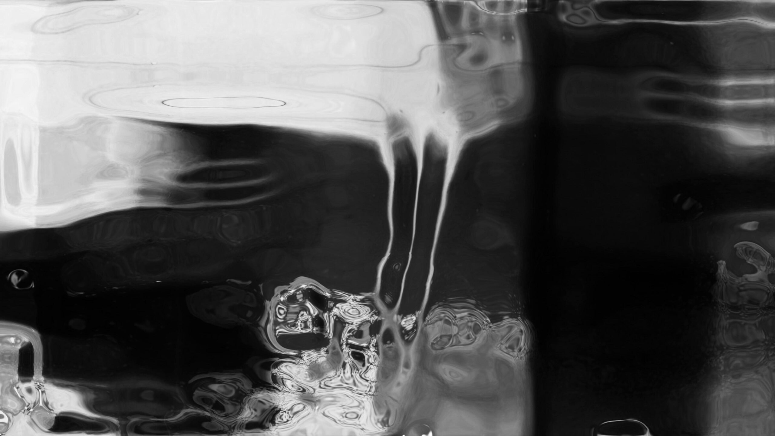 4K looping video of black white flowing liquid distortions.