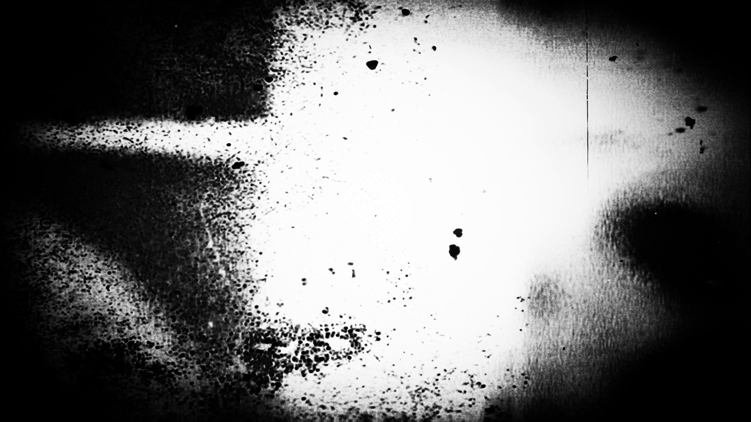 4K looping video of black-and-white film leader with specks, vertical lines, floating circles, and faint light streaks — retro glitch effect ideal for dark themes or atmospheric backgrounds.