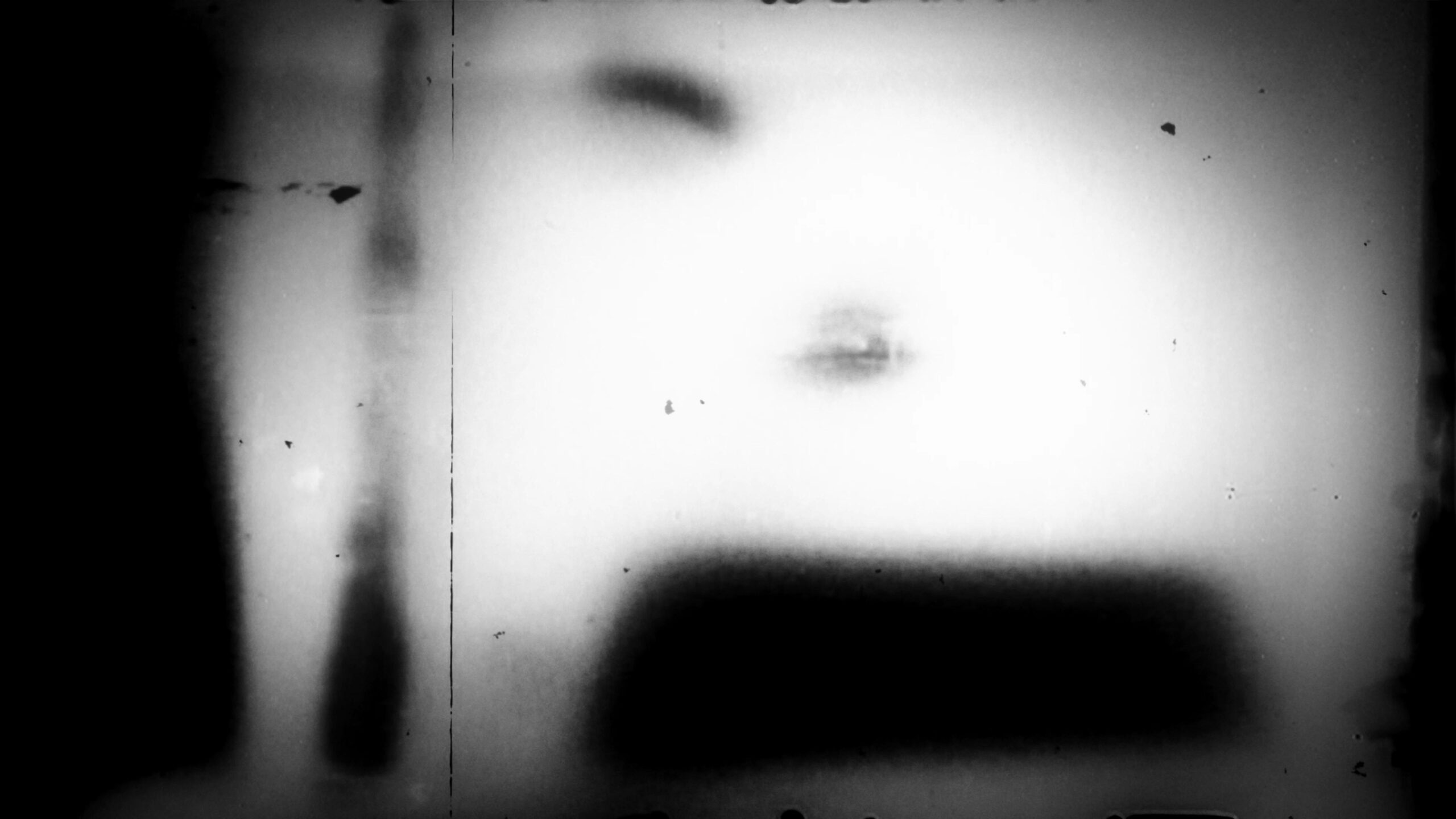 Vintage 16mm film leader with ghostly blur effects and scratched textures.