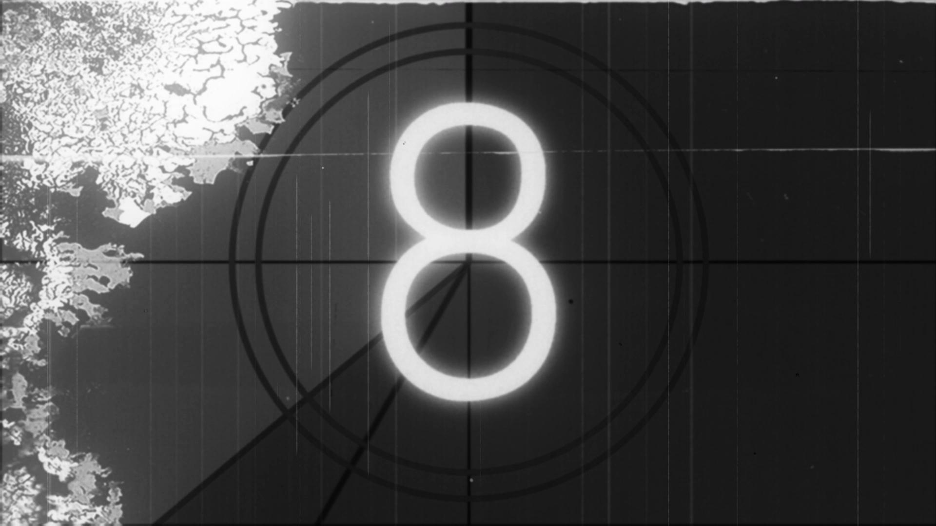 Black-and-white 16mm countdown numbers with target rings and distressed edges.