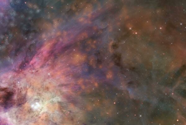 A mesmerizing video of a nebula with colorful swirling clouds of gas and interstellar dust, highlighted by twinkling stars and ethereal galactic patterns in the cosmos.