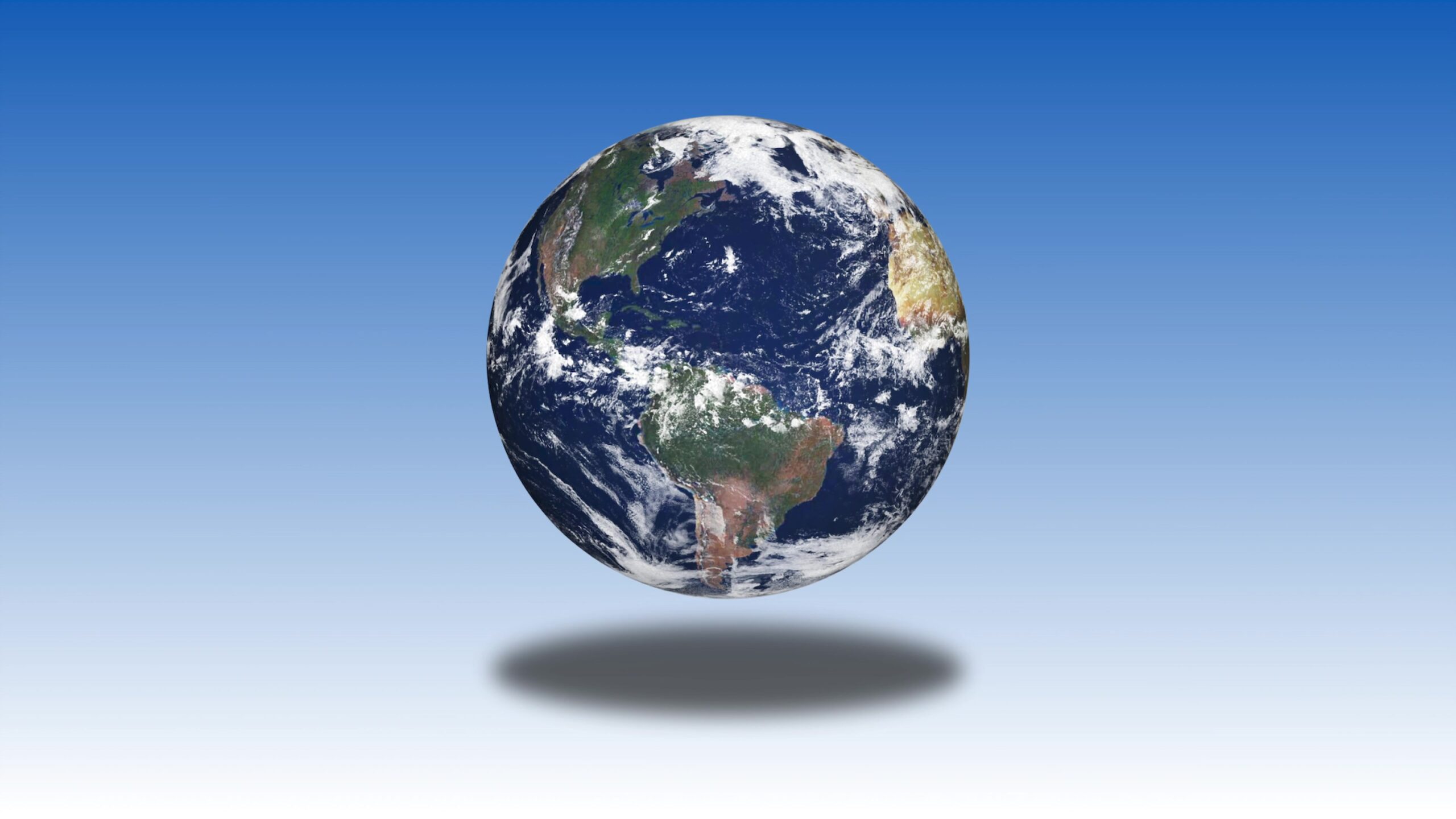 Digital 3D animation loop of a rotating Earth against a gradient blue background, featuring continents and oceans with a prominent shadow effect.
