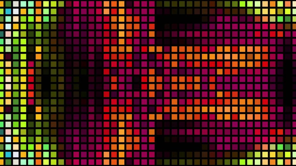 A vibrant geometric design featuring a grid of colorful pixels in shades of neon green, cyan, yellow, magenta, and orange, contrasted with black blocks to create a striking abstract pattern.