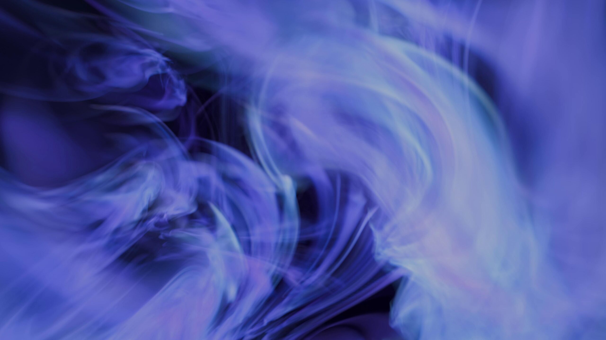 Abstract Blue Smoke Twists Against Dark Background