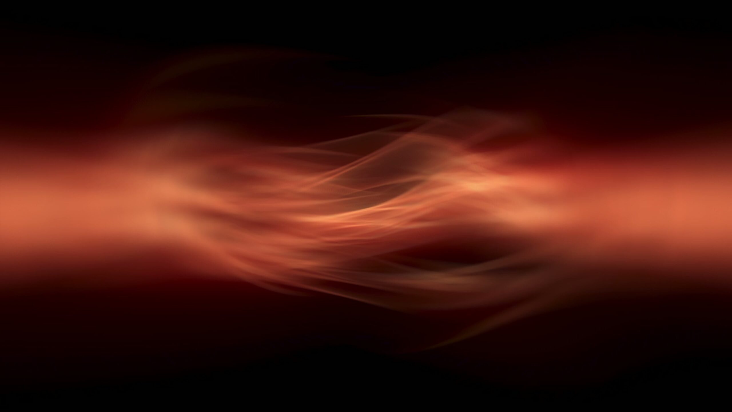 Abstract fiery light trails against deep black video background.