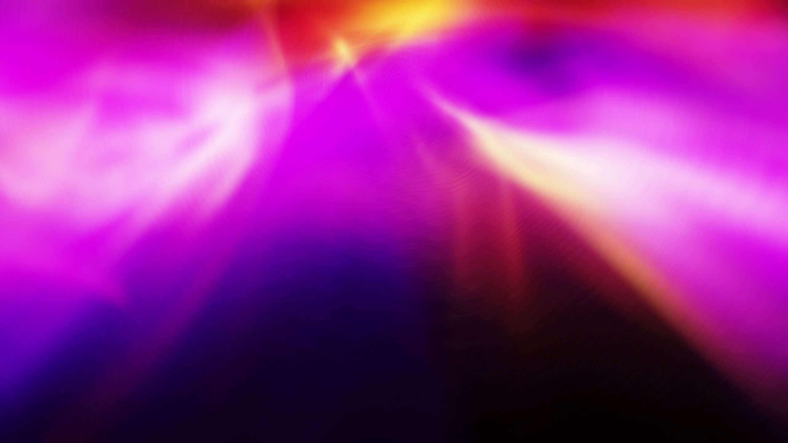 Dynamic abstract 4K looping video with vibrant swirls of purple, pink, and yellow hues creating an impression of light bursts and a sense of energy.