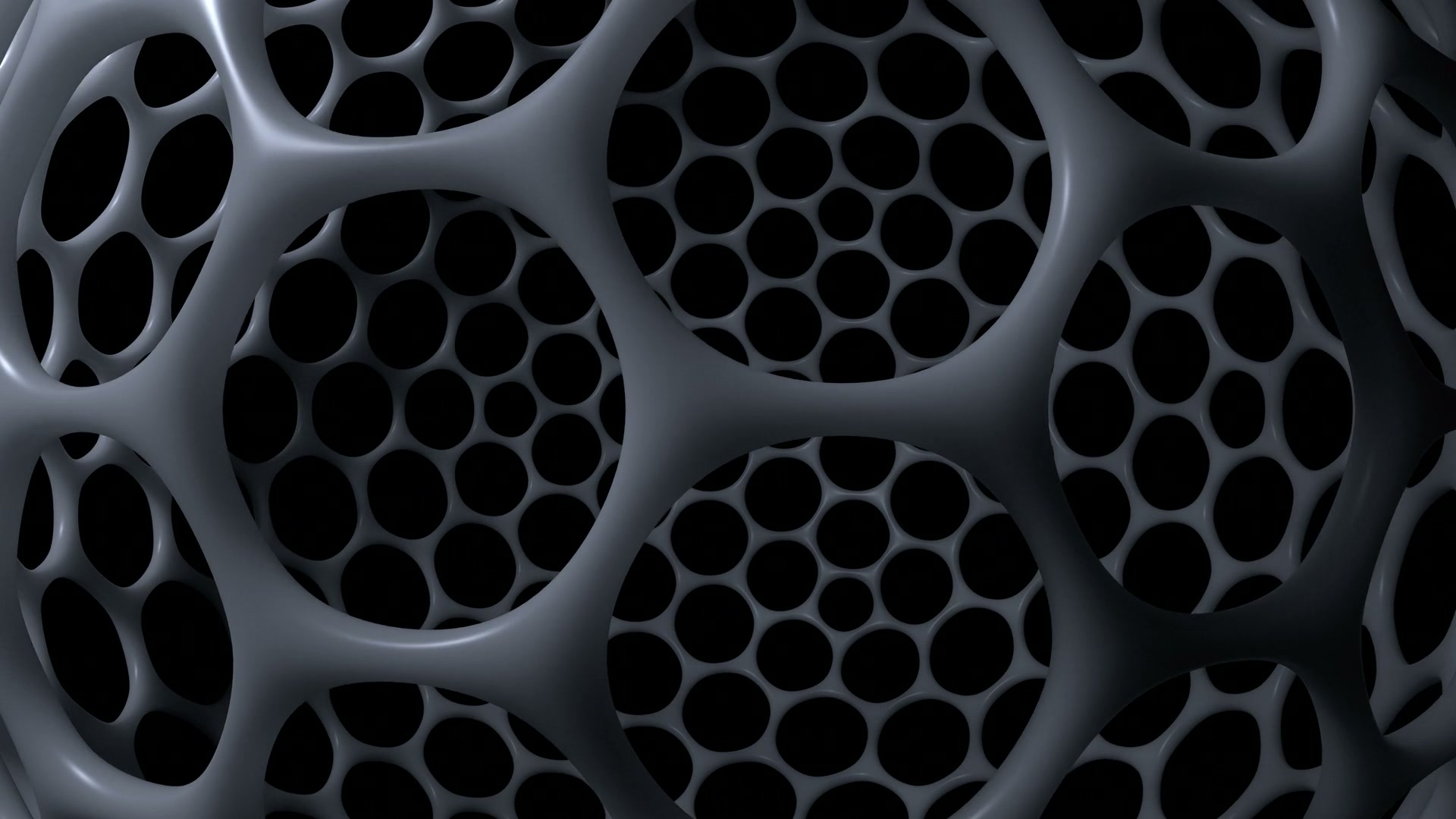 Abstract video loop of a dark honeycomb structure featuring a sleek, interconnected design with circular nodes, set against a contrasting black background for a modern, futuristic aesthetic.