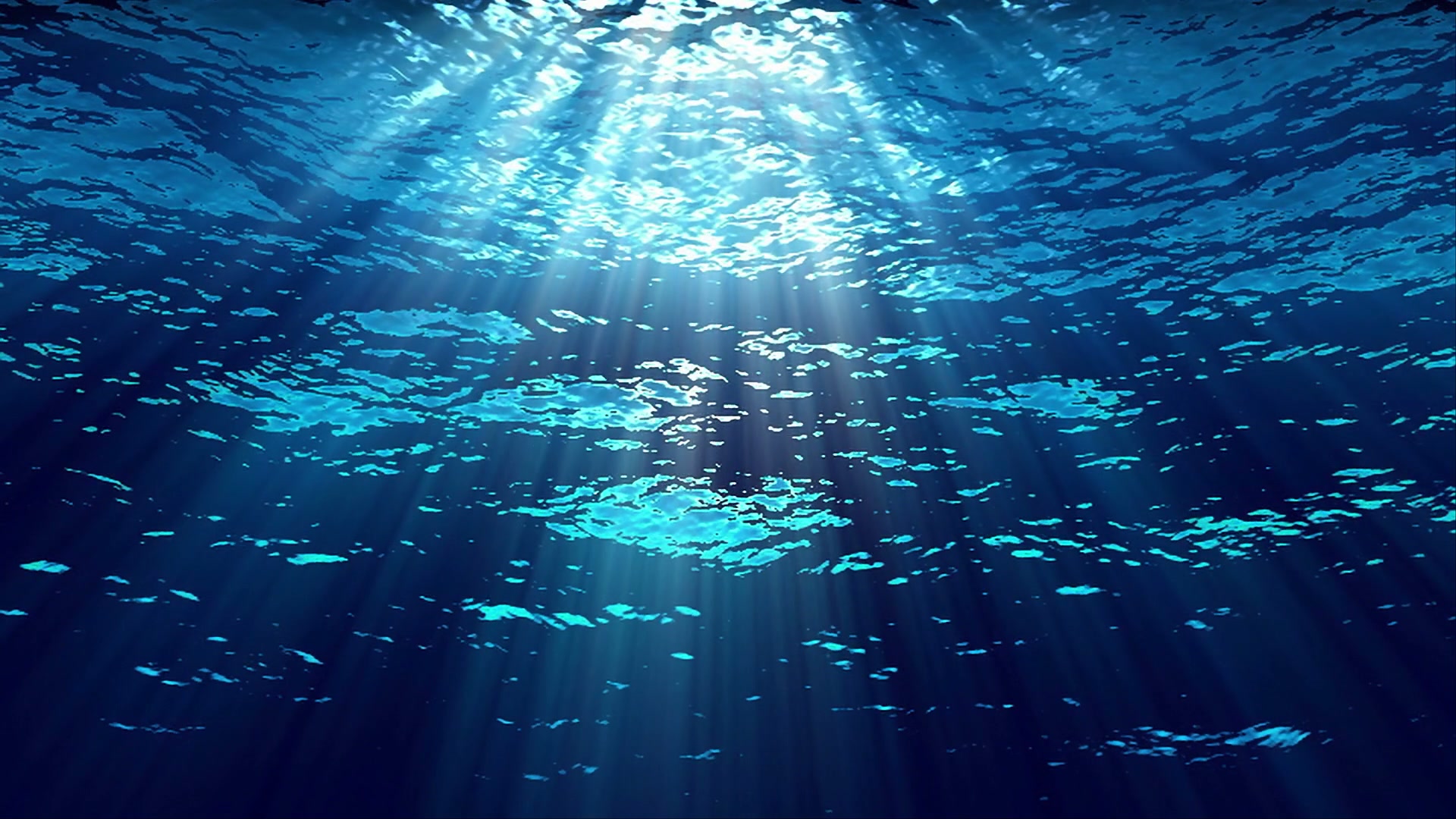 Sunlight filtering through the ocean's surface, casting a radiant glow and creating intricate patterns in the tranquil, deep blue water.