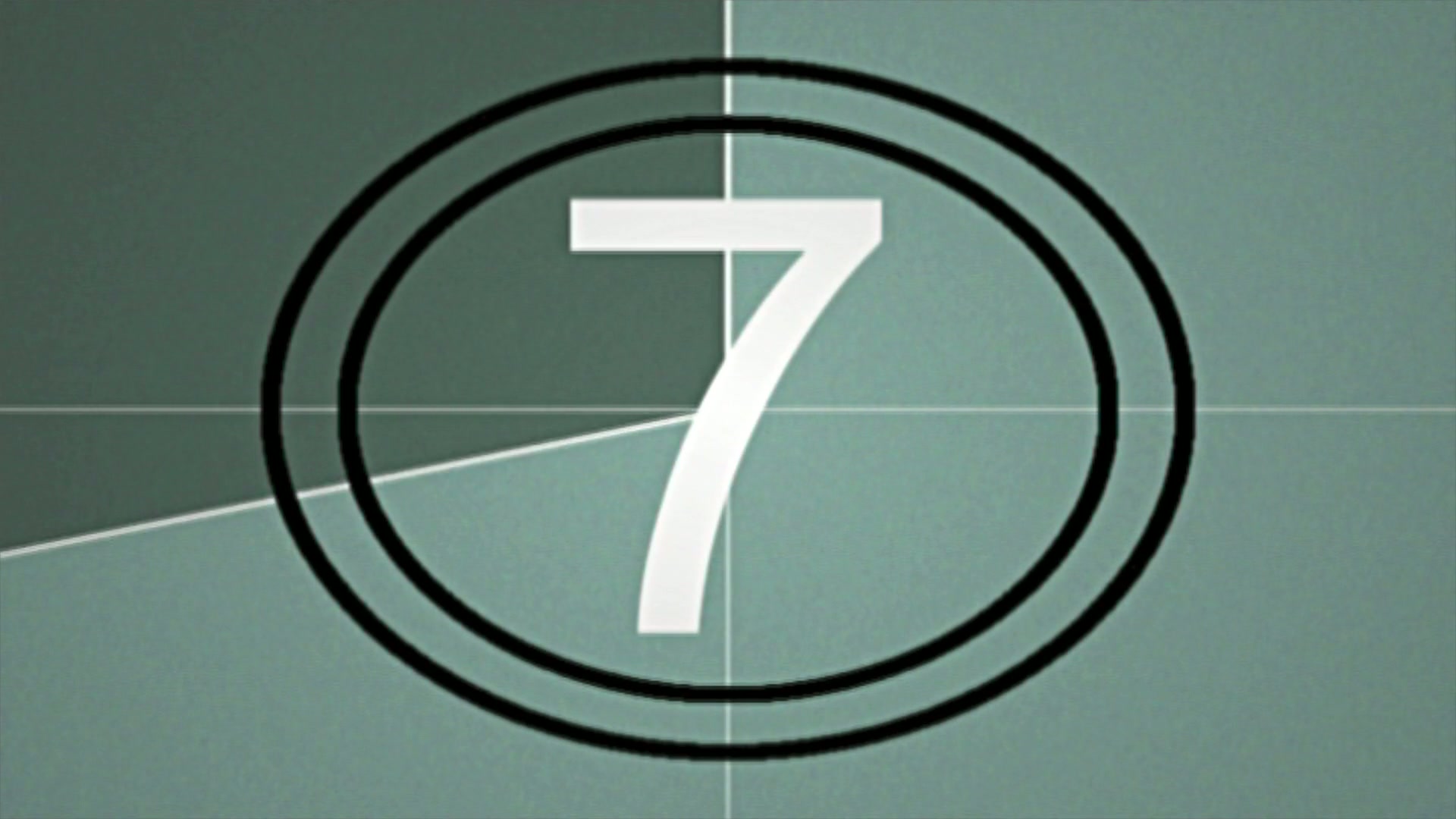 Classic vintage film countdown with the numbers in white surrounded by concentric circles on a textured green background.
