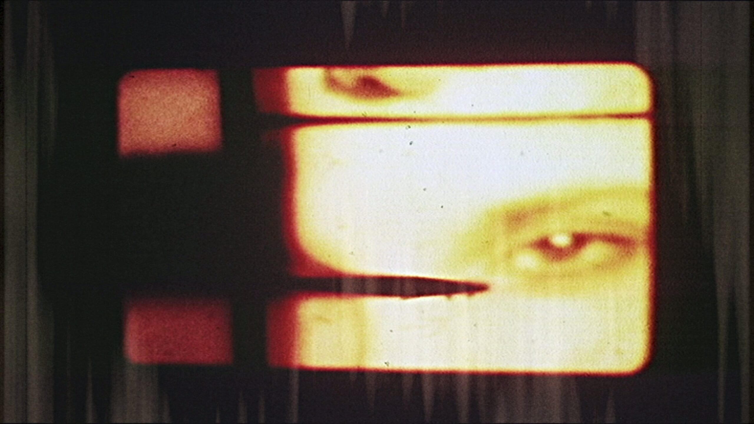 Distorted TV Screen Showing Red-Glowing Eye And Blurred Blade Against Dark Curtains