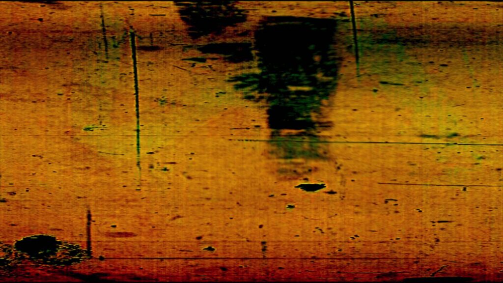 HD video of vintage 16mm film leader with scratches, dust, hand-drawn markings, and cyan light streaks on a green background.