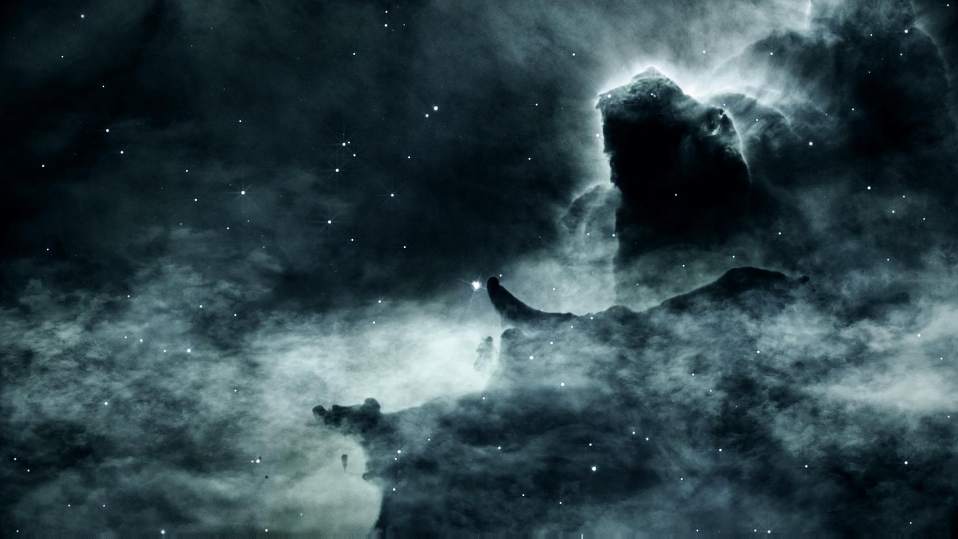Nebulae glow amidst twinkling stars under mysterious formations