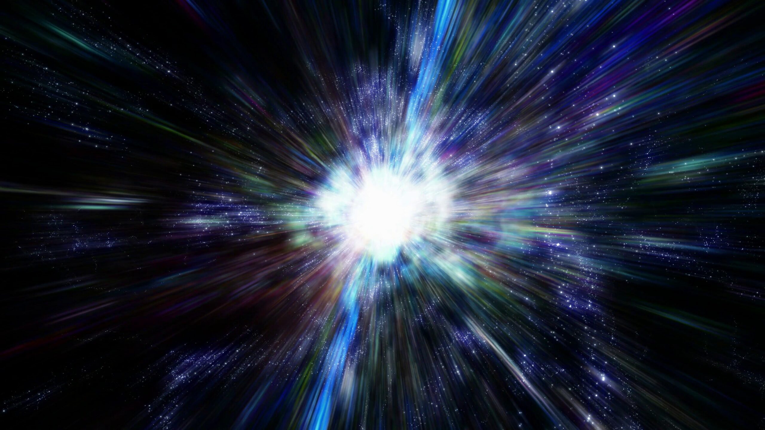 A dazzling cosmic explosion radiates vivid colors against dark space filled with twinkling stars.