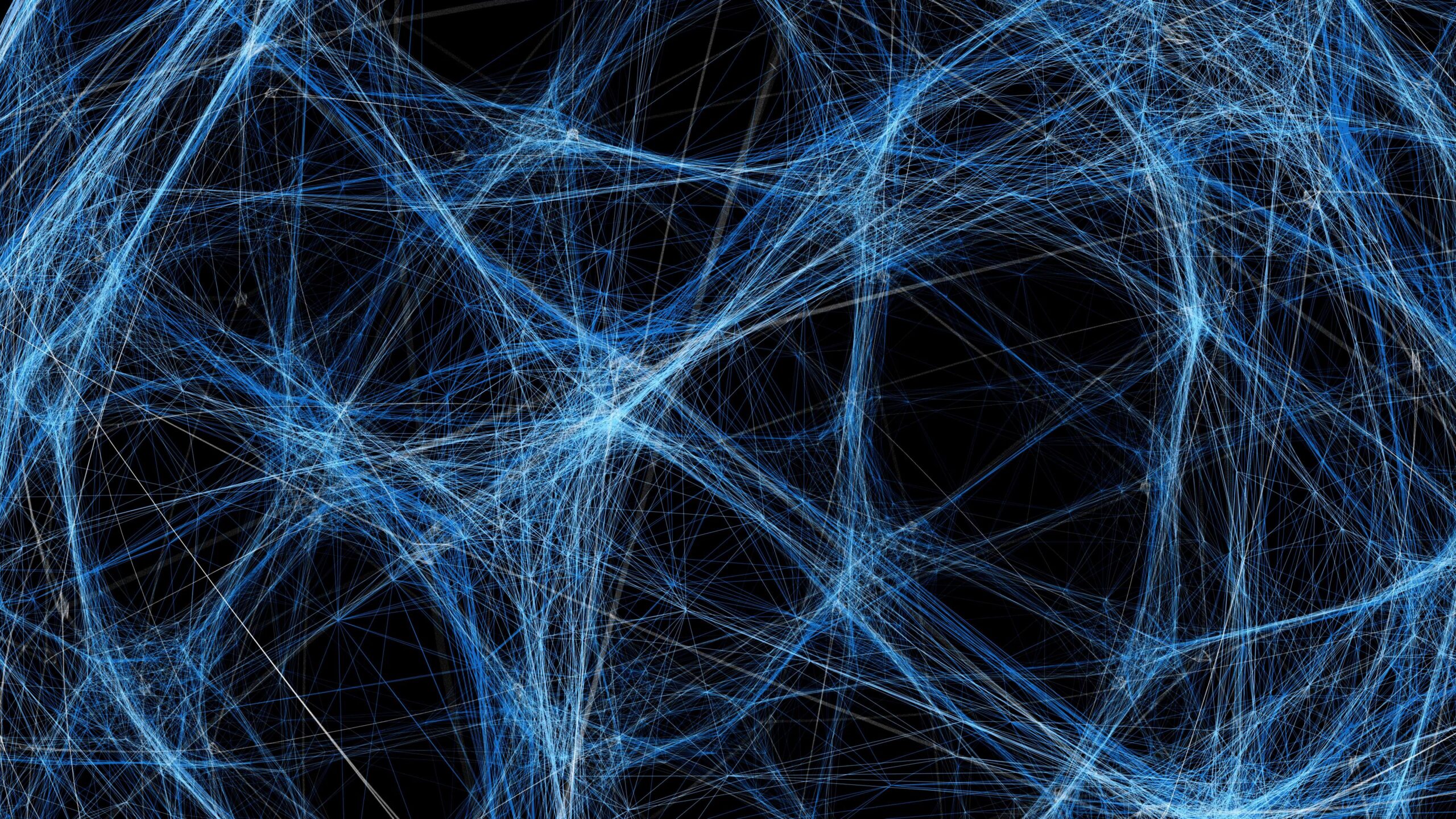A dynamic web of electric-blue strands pulses softly over deep blackness, resembling living circuits or nebulae caught in motion.