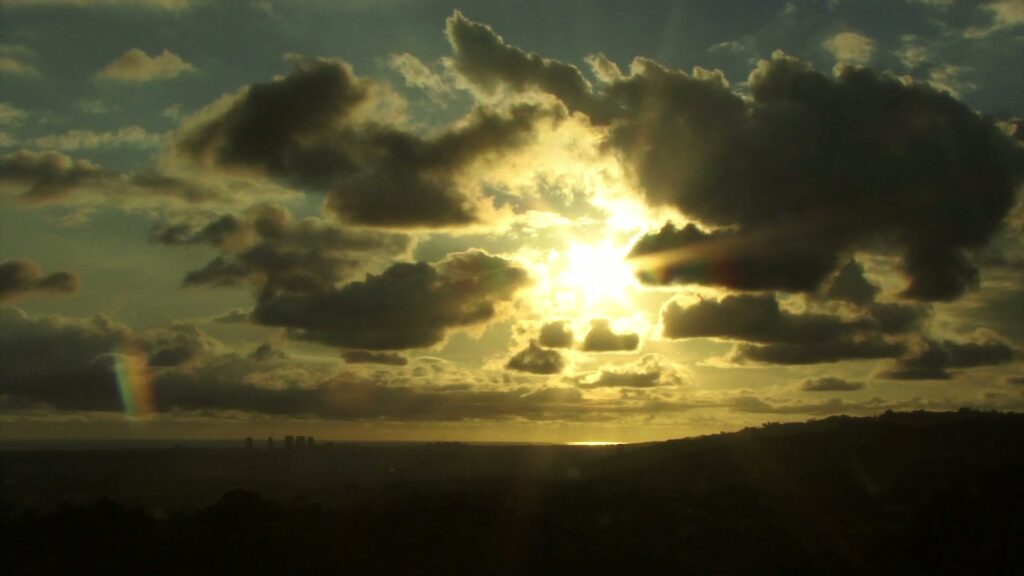 The video features a striking view of a time-lapse sky during sunset.