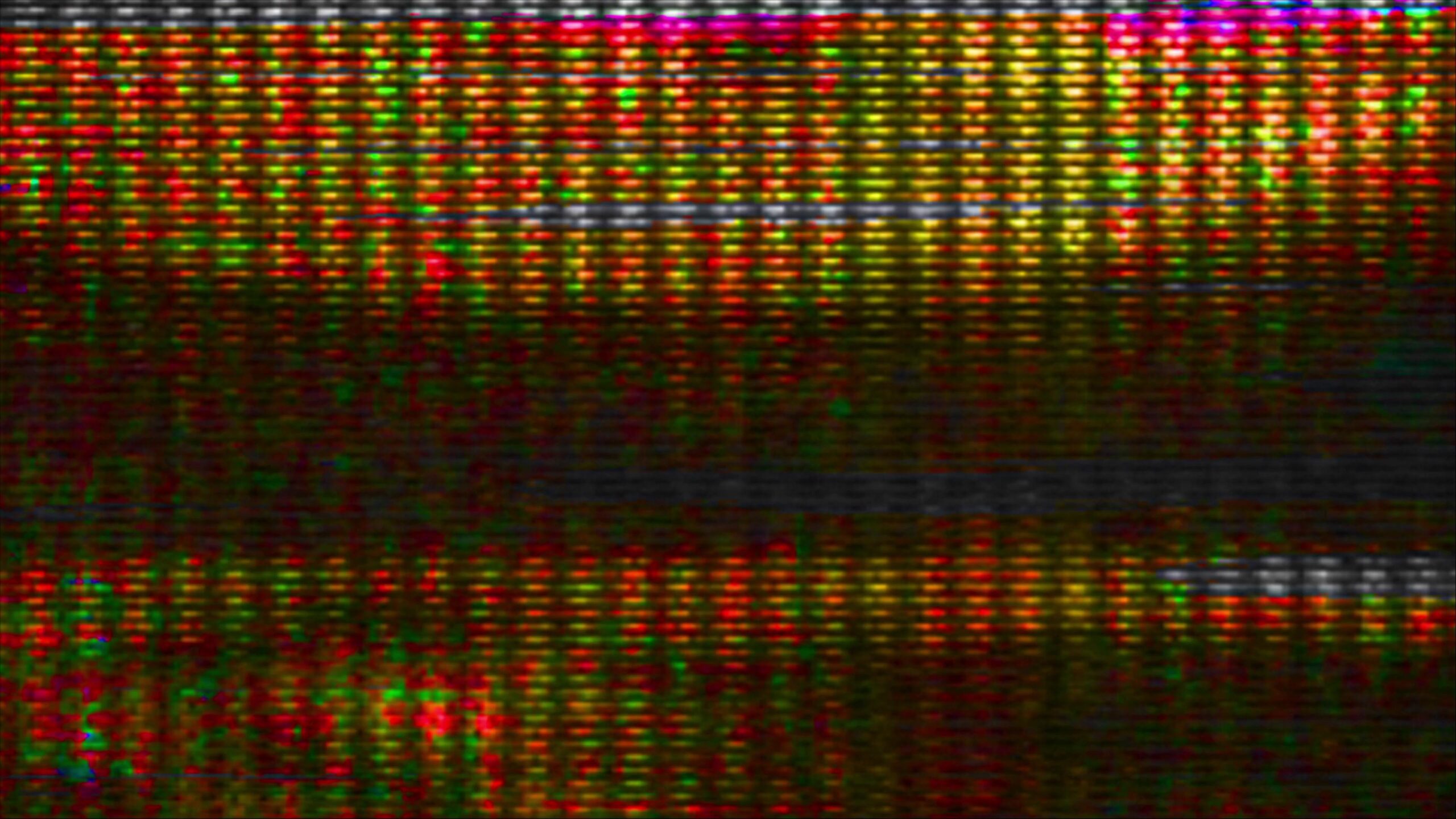 Vintage CRT screen with pixelated glitch art and color bleed forming alphanumeric characters.