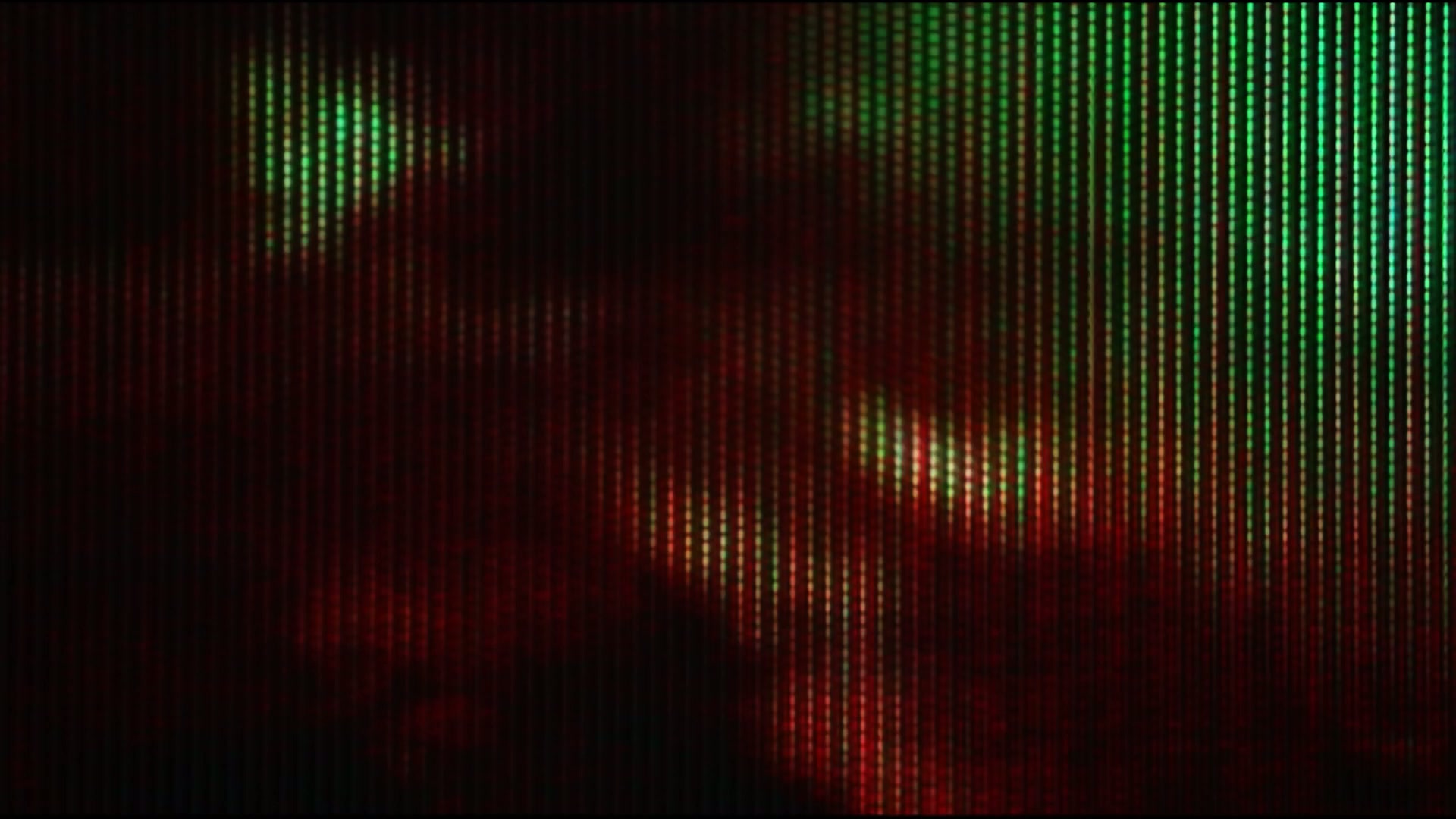 Close-up video loop of a pixelated digital display screen showing vibrant red, green and blue abstract patterns with vertical rows of tiny lights, resembling a malfunctioned or artistically altered monitor.