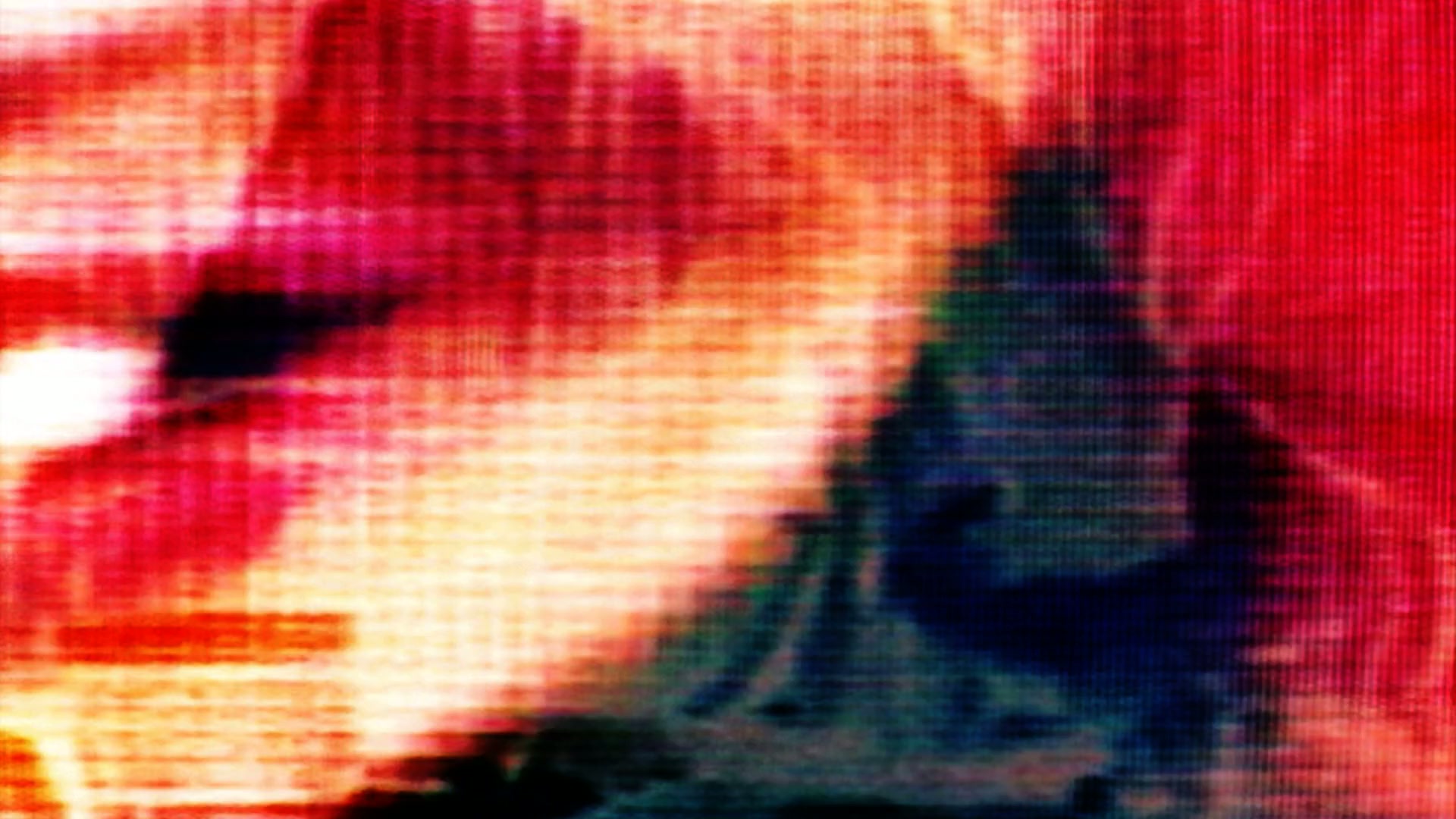 A vibrant and abstract close-up video loop of a pixelated digital screen, showcasing vivid red, orange, and yellow hues with visible pixels creating a mysterious and dynamic effect.