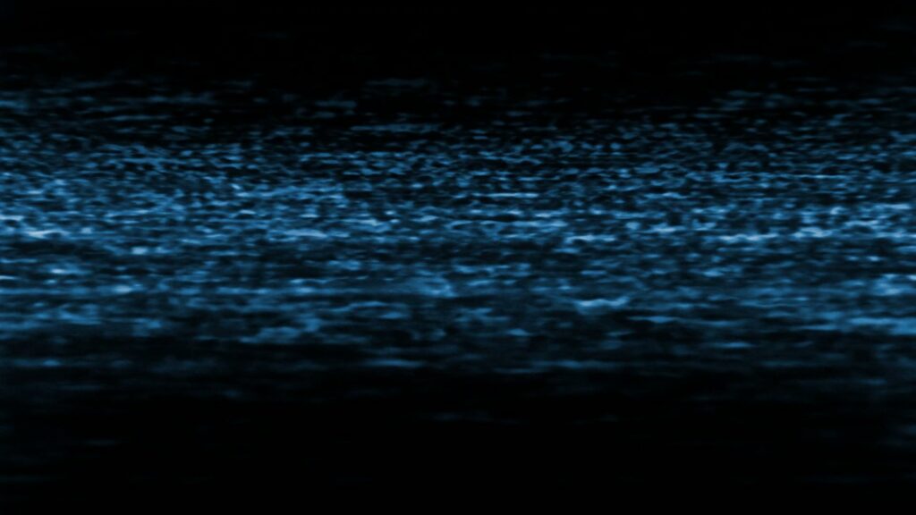Abstract HD video loop of blue static patterns reminiscent of analog television interference with scattered light blue speckles and horizontal lines, creating a mysterious and nostalgic feel.