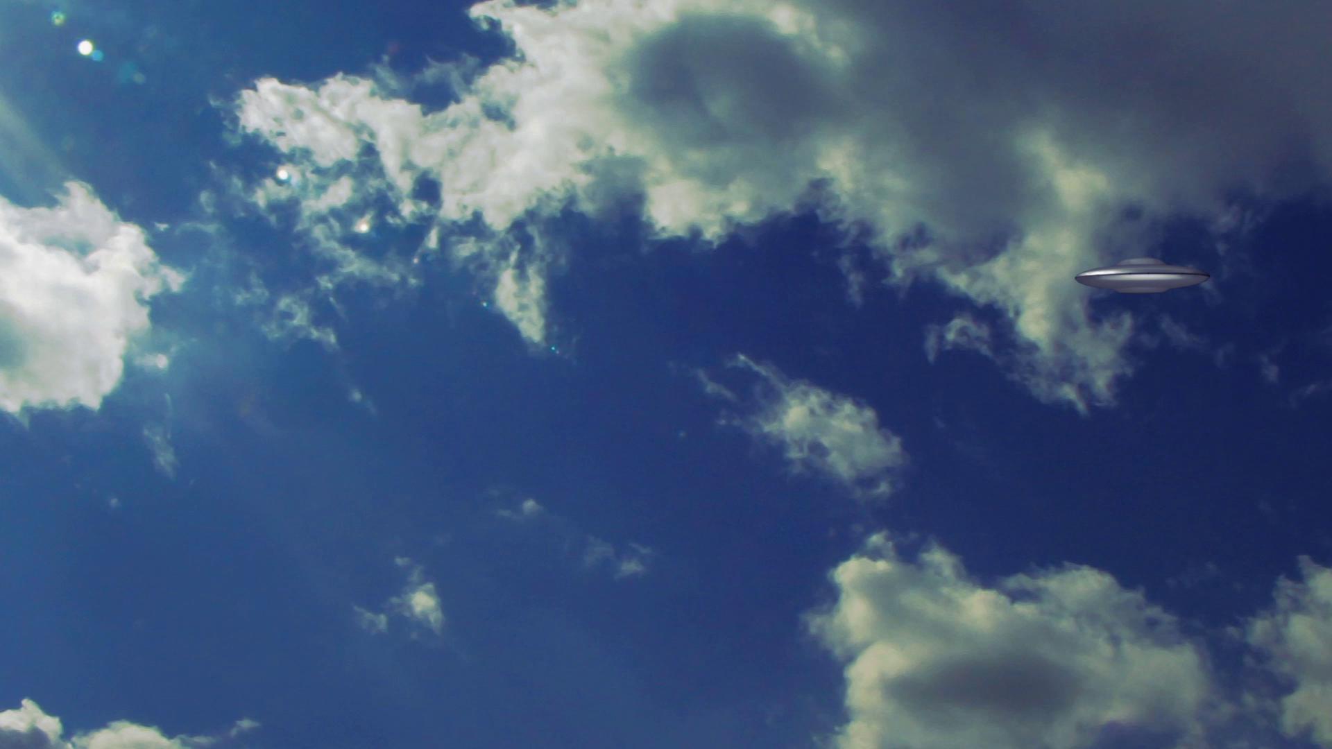 HD video of a UFO traveling in a bright blue sky with fluffy white clouds.